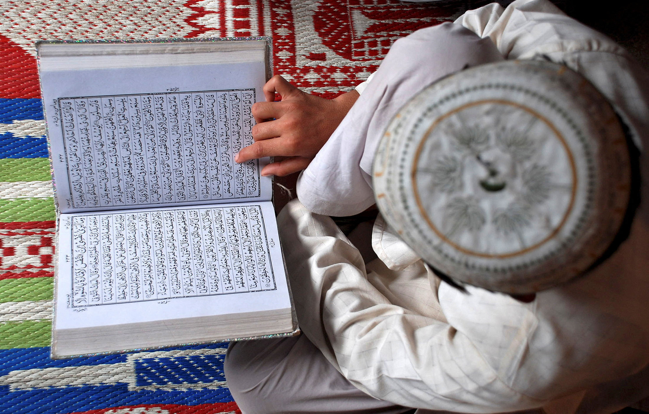 A Muslim boy reads the Koran at a madrasa, or Islamic school. Photo: Reuters