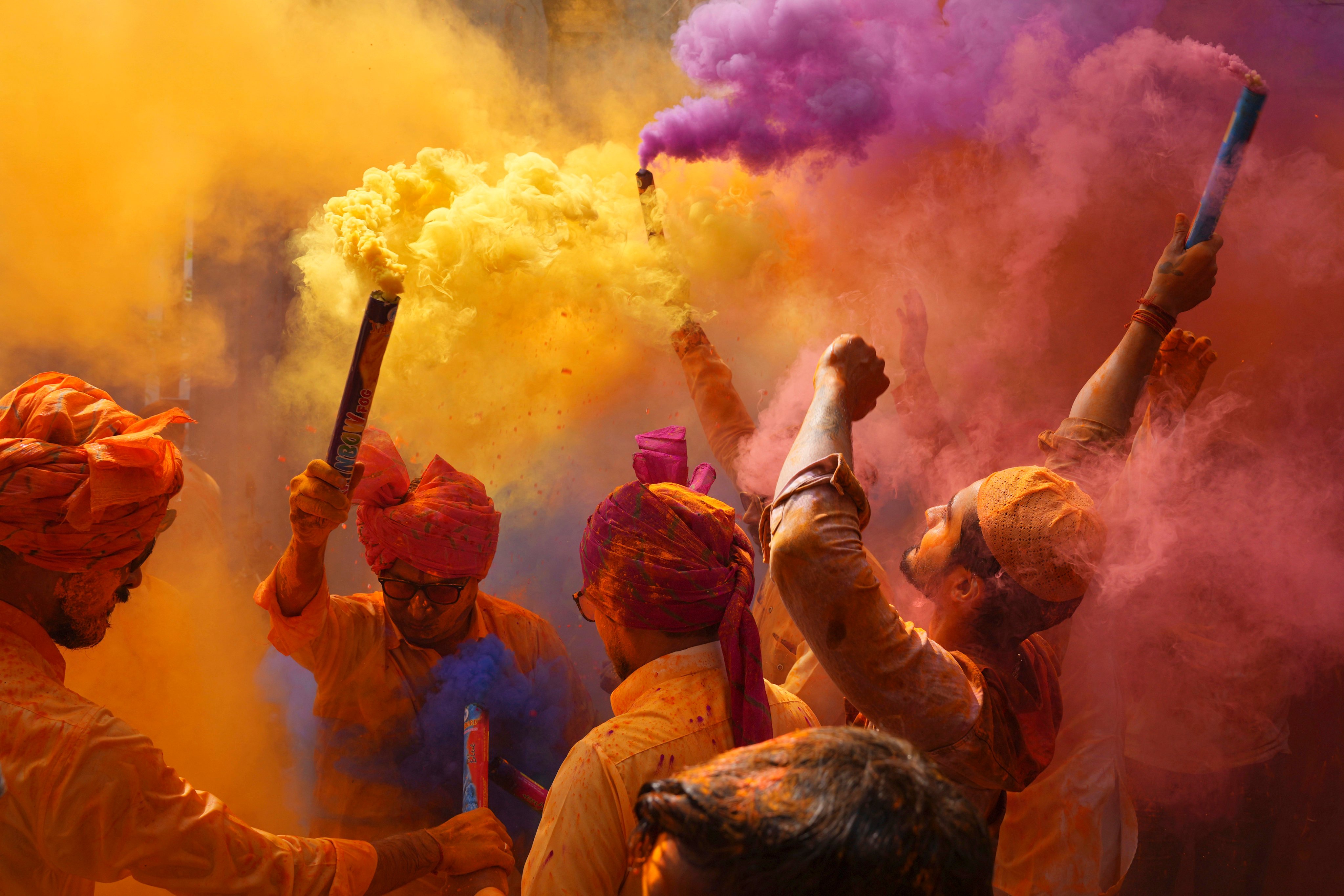 People sing, dance and throw colours at each other to celebrate Holi in Hyderabad, India, in 2023. Photo: AP
