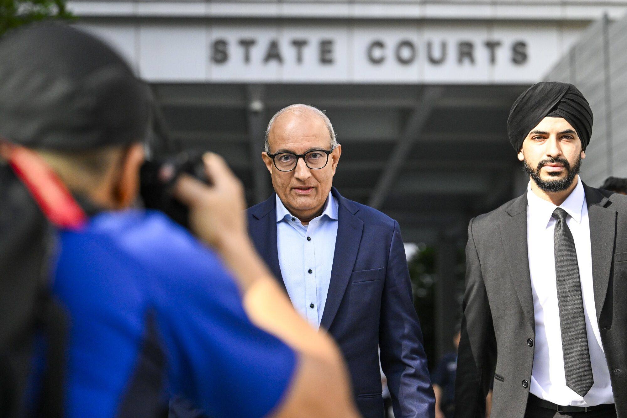 S. Iswaran, Singapore’s former transport minister (centre)  leaves the Singapore State Courts on Monday after more corruption charges were filed against him. Photo: Bloomberg