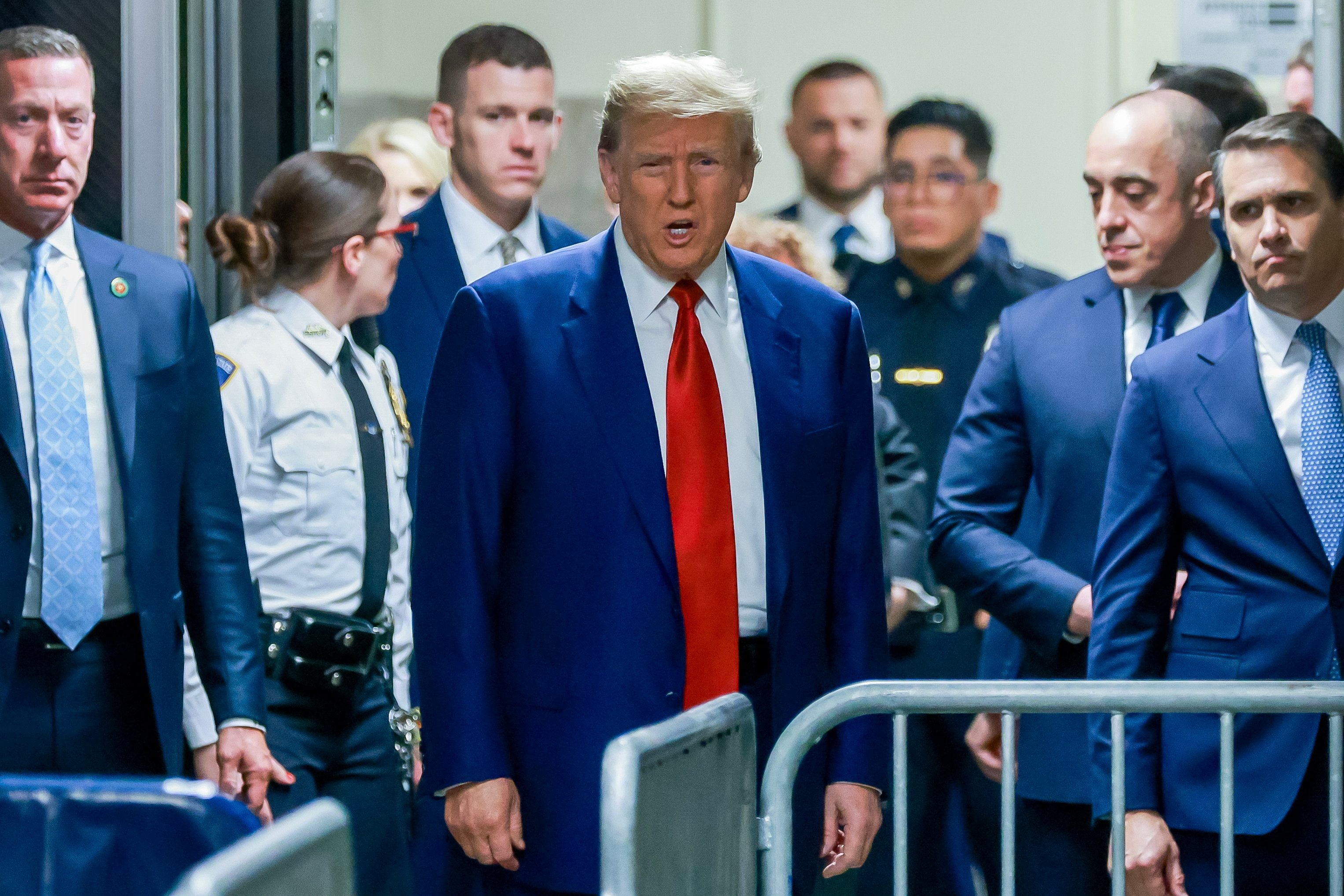 Former US president Donald Trump, centre, arrives for the start of a hearing at New York Criminal Court on Monday. Photo: EPA-EFE