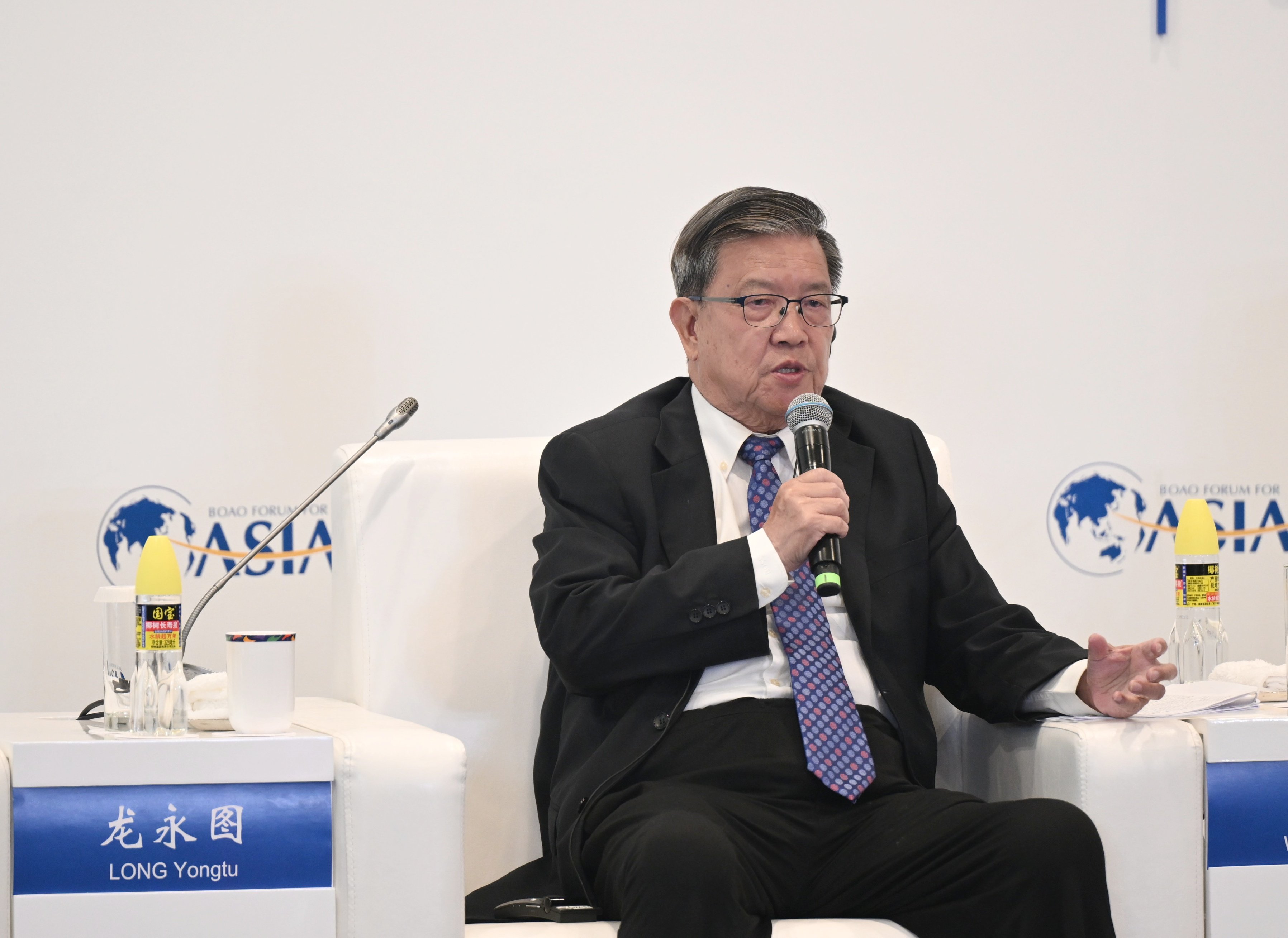 Former Chinese trade official Long Yongtu speaks at the Boao Forum for Asia on Tuesday. He accused Washington of “dismantling the system” of trade that it helped build. Photo: Getty Images