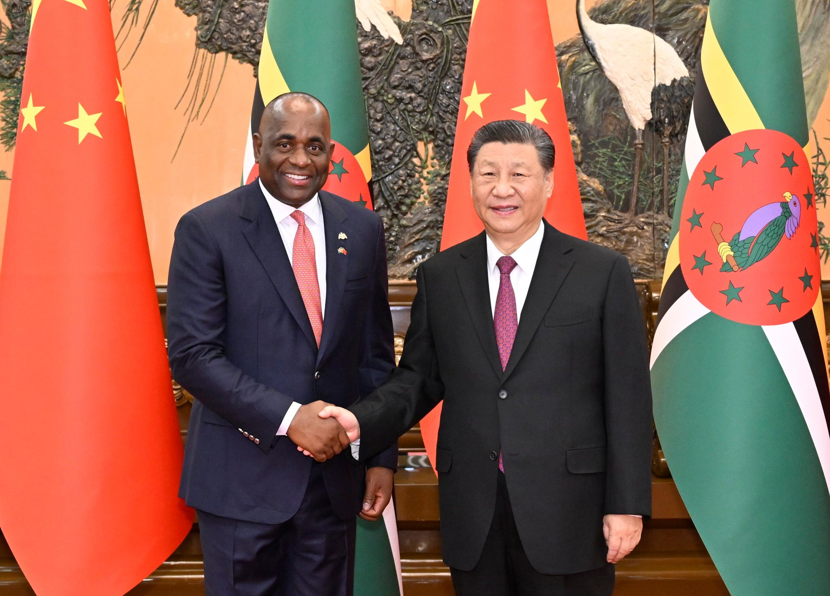 Dominican Prime Minister Roosevelt Skerrit is welcomed to the Great Hall of the People in Beijing by Chinese President Xi Jinping on Monday. Photo: EPA