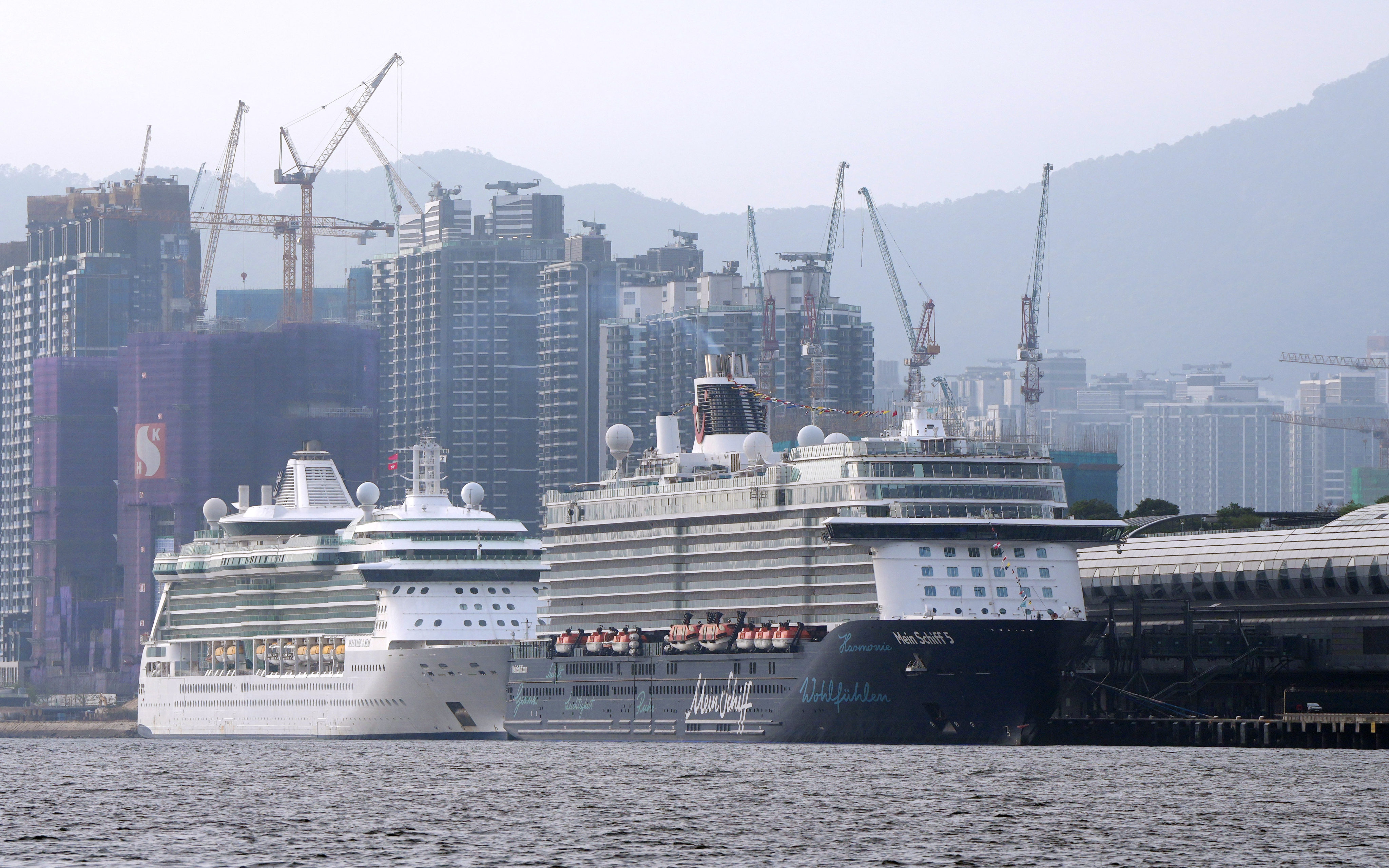 Cruise ships Mein Schiff 5 (right) and Serenade of the Seas dock at the Kai Tak Cruise Terminal. Photo: Sam Tsang