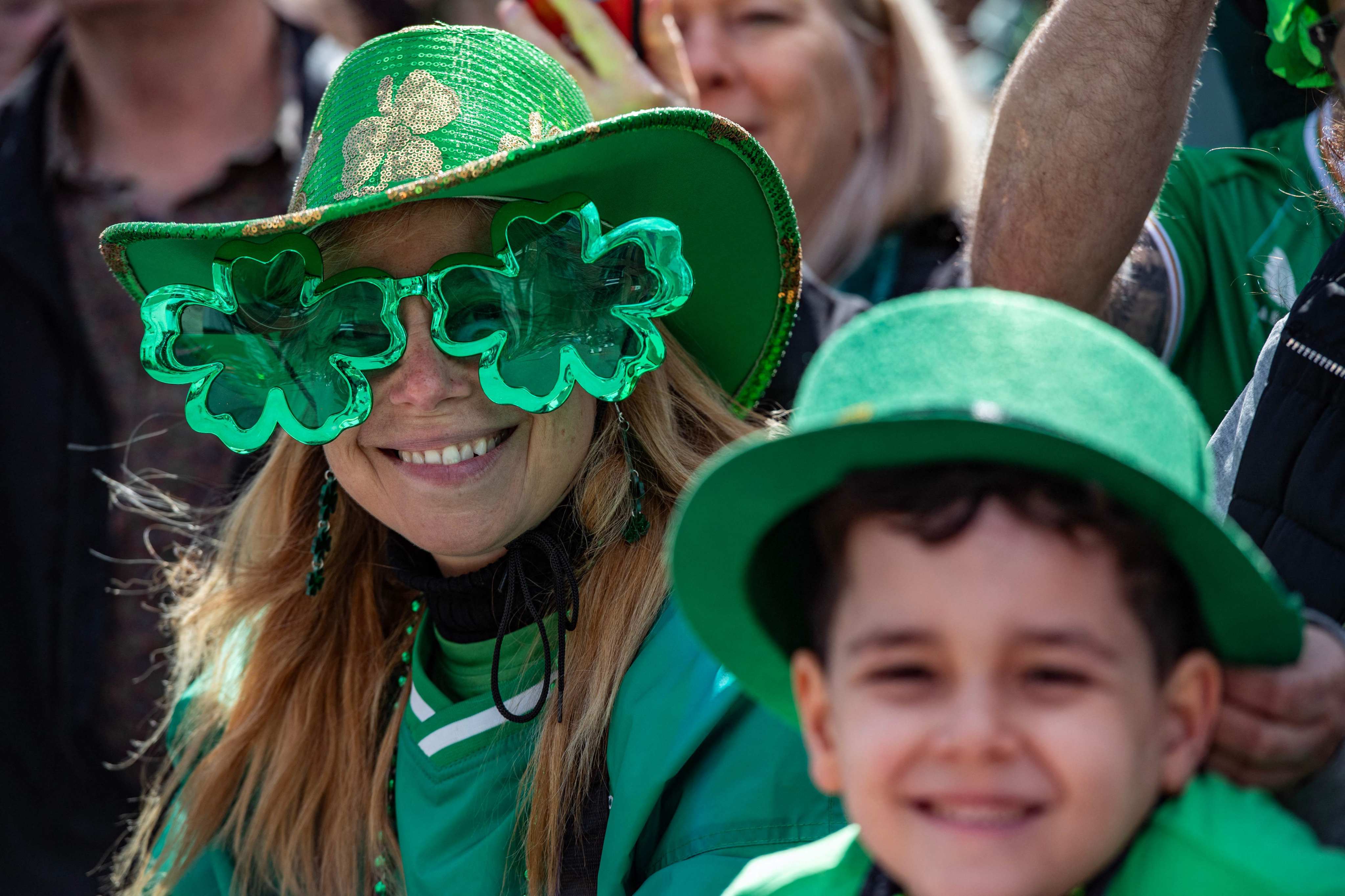 People watch the St Patrick’s Day Parade in Boston, in the US state of Massachusetts, on March 17, 2024. Photo: AFP