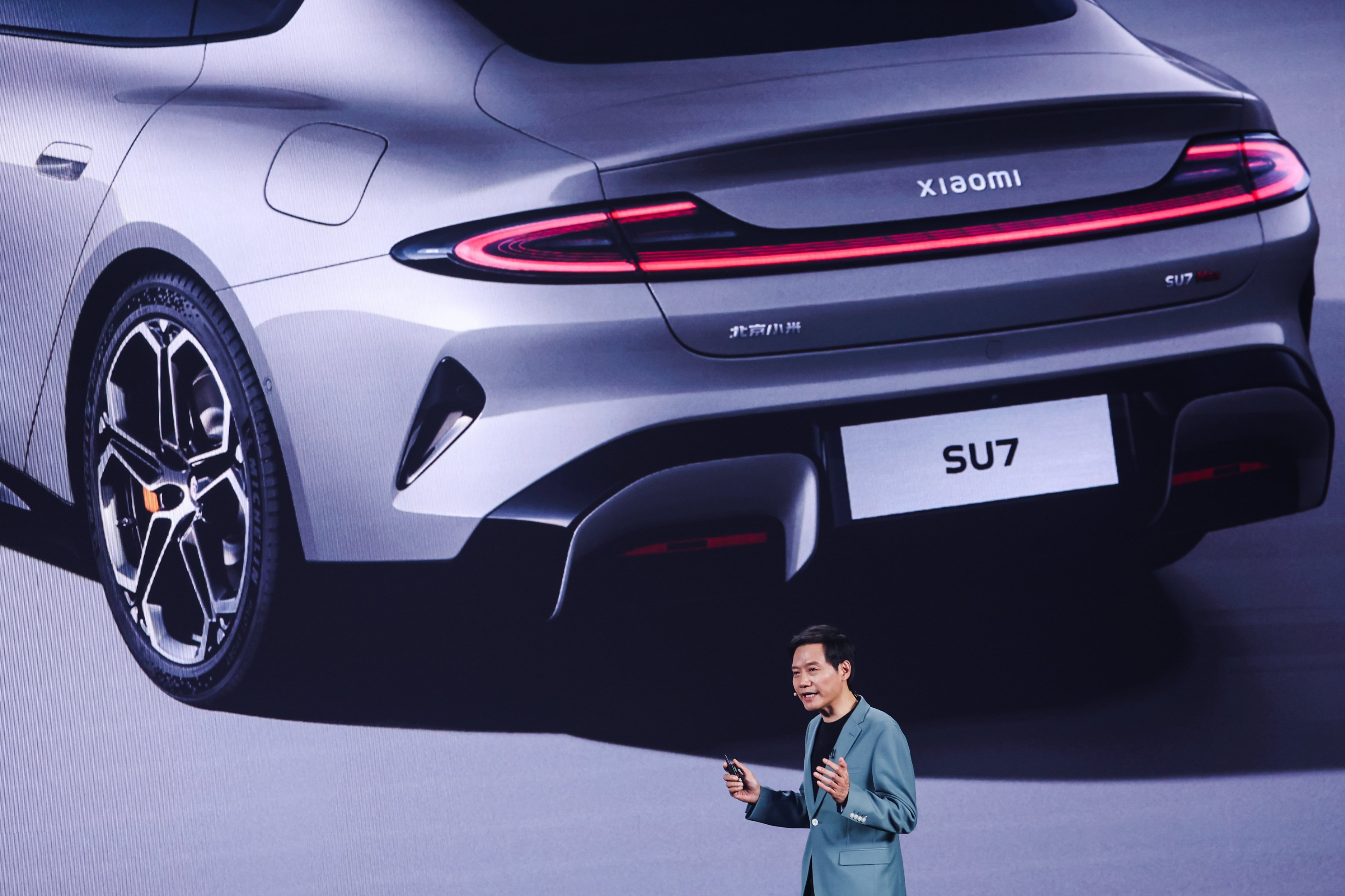 Lei Jun, founder and CEO of Xiaomi, speaks during the SU7 electric car launch ceremony in Beijing on Thursday. Photo: EPA-EFE