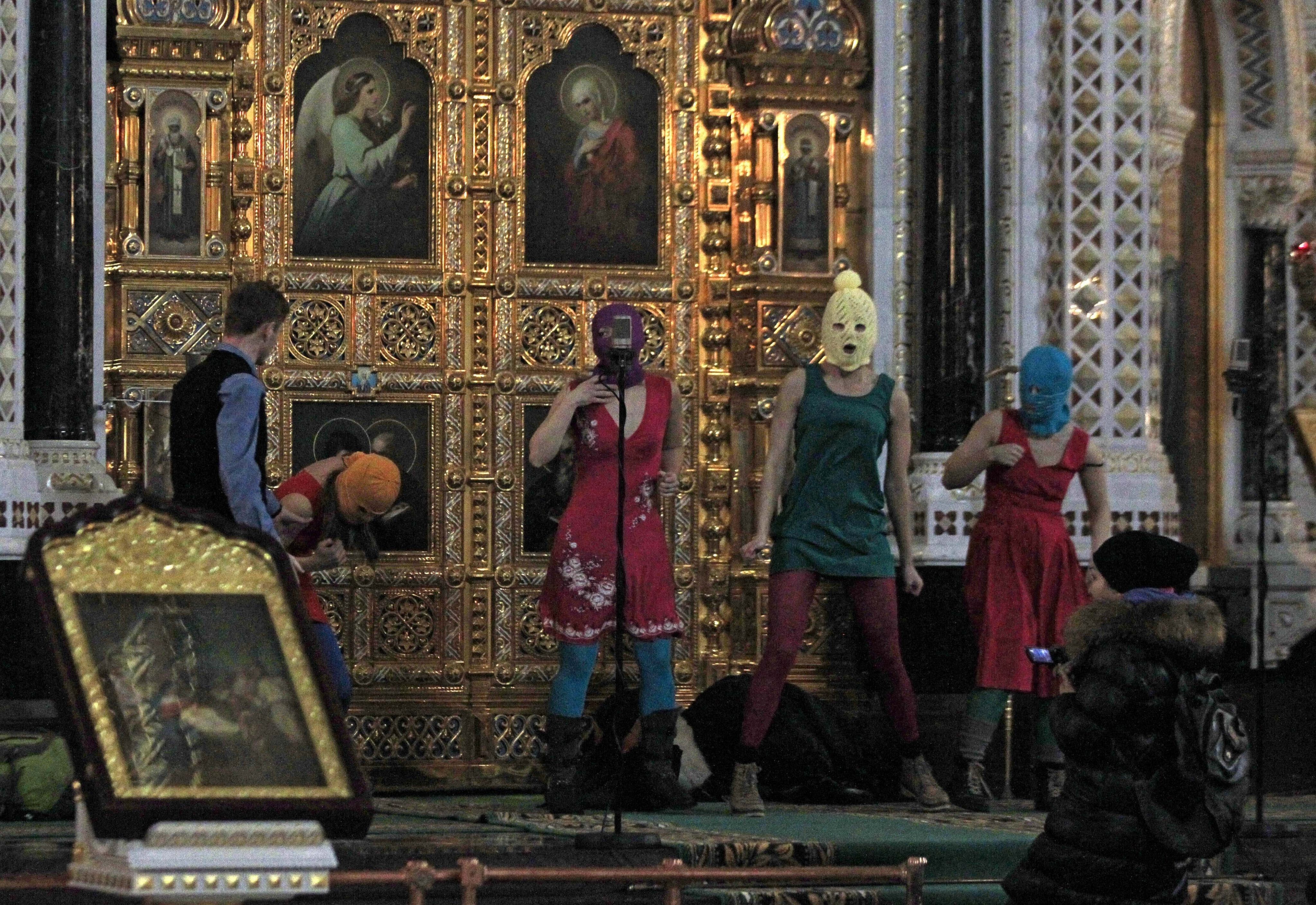 Masked members of Russian feminist group Pussy Riot protest inside the Christ the Savior Cathedral in Moscow in 2012. On Wednesday, Russia sentenced band member Lyusya Shtein to six years in prison in absentia for anti-war social media posts. Photo: AP