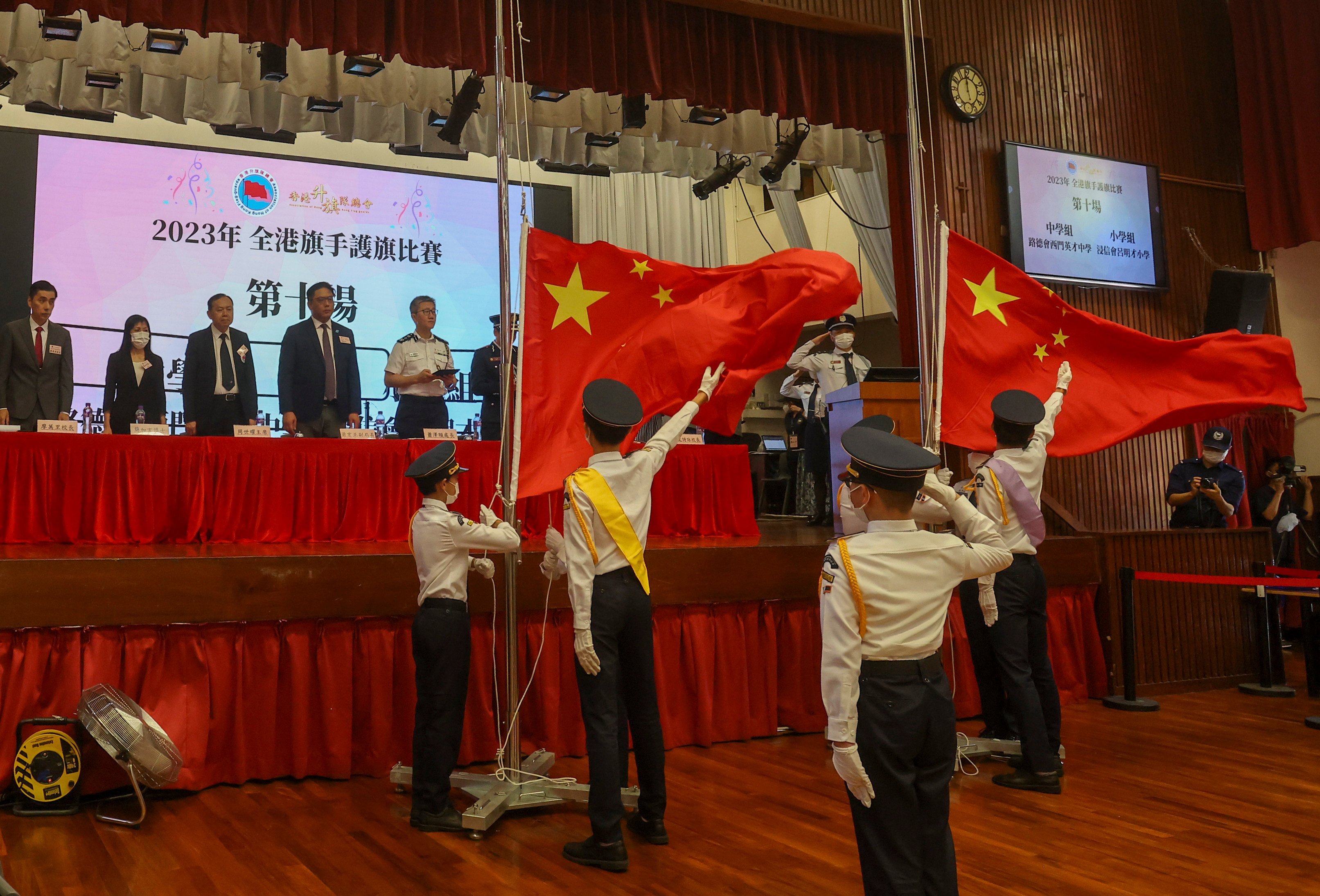 Pupils take part in a flag raising competition. Teachers have been asked to brief pupils on a widened scope of national security concerns outlined by the country. Photo: Jonathan Wong