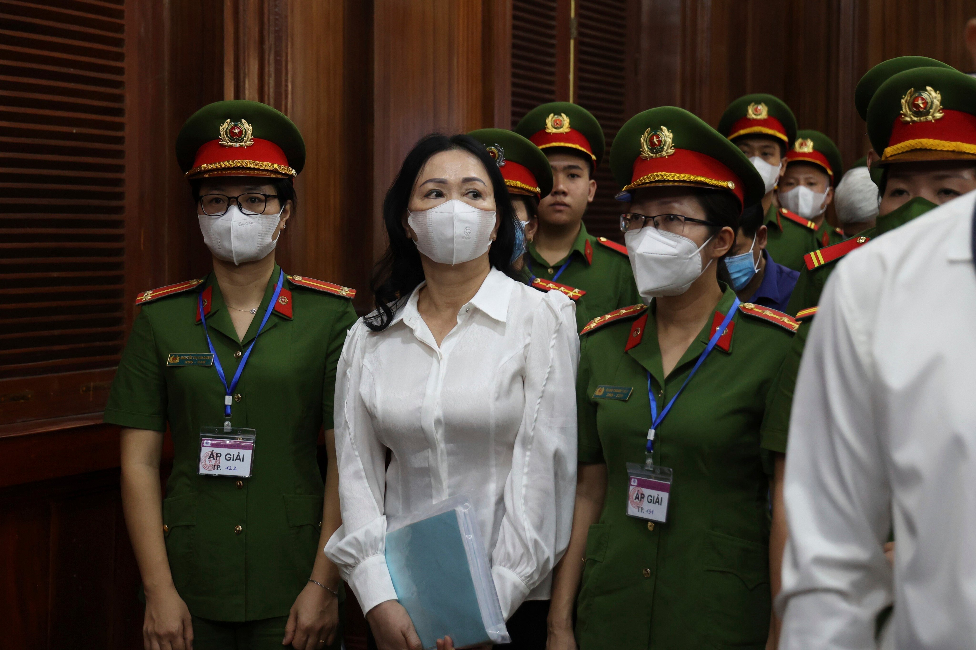 Vietnamese real estate tycoon Truong My Lan is escorted into a courtroom in Ho Chi Minh city,  on March 5. Photo: AP