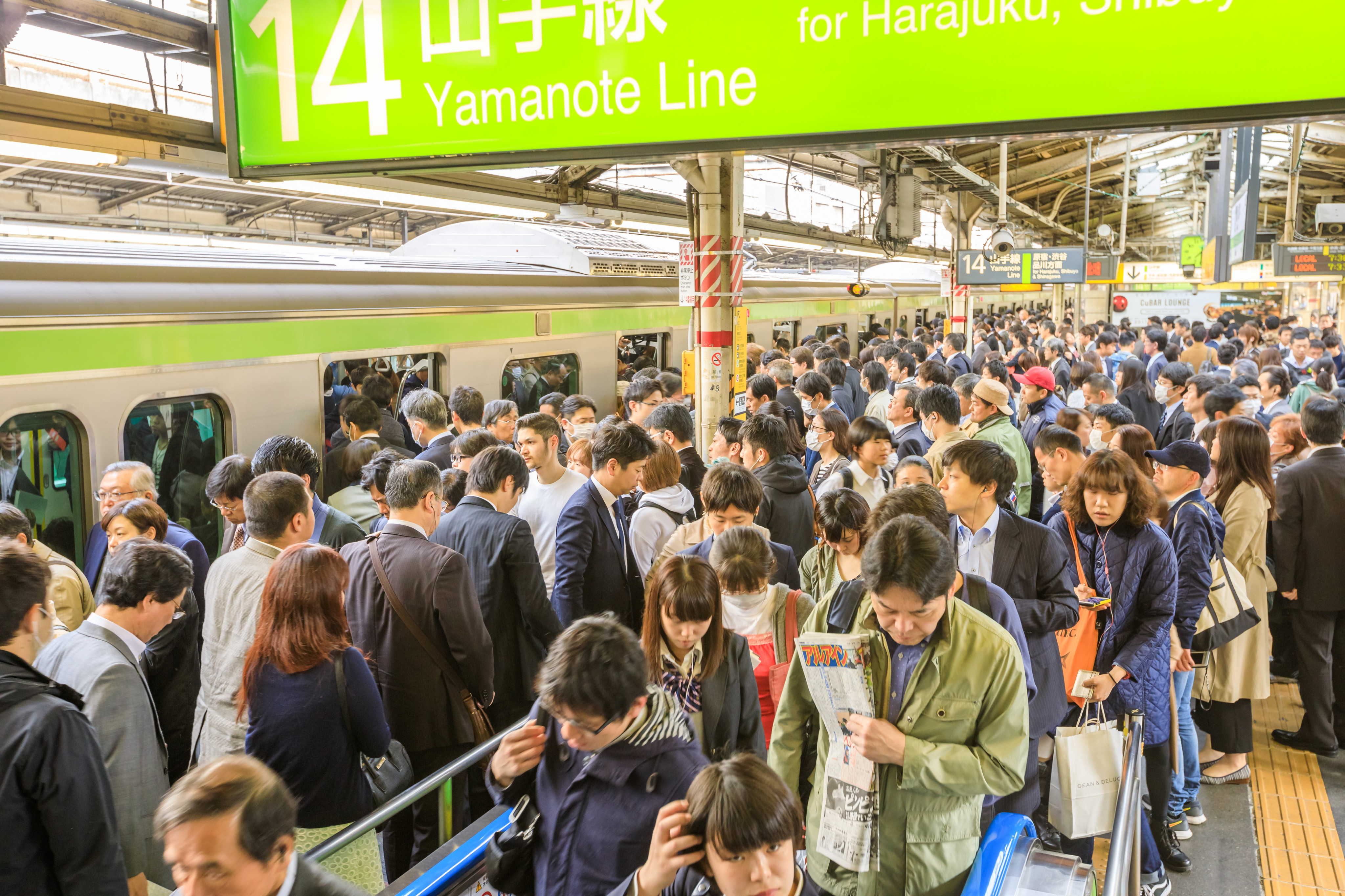 Crowd of commuters waiting for rail train at Shinjuku Station in Tokyo. Photo: Shutterstock