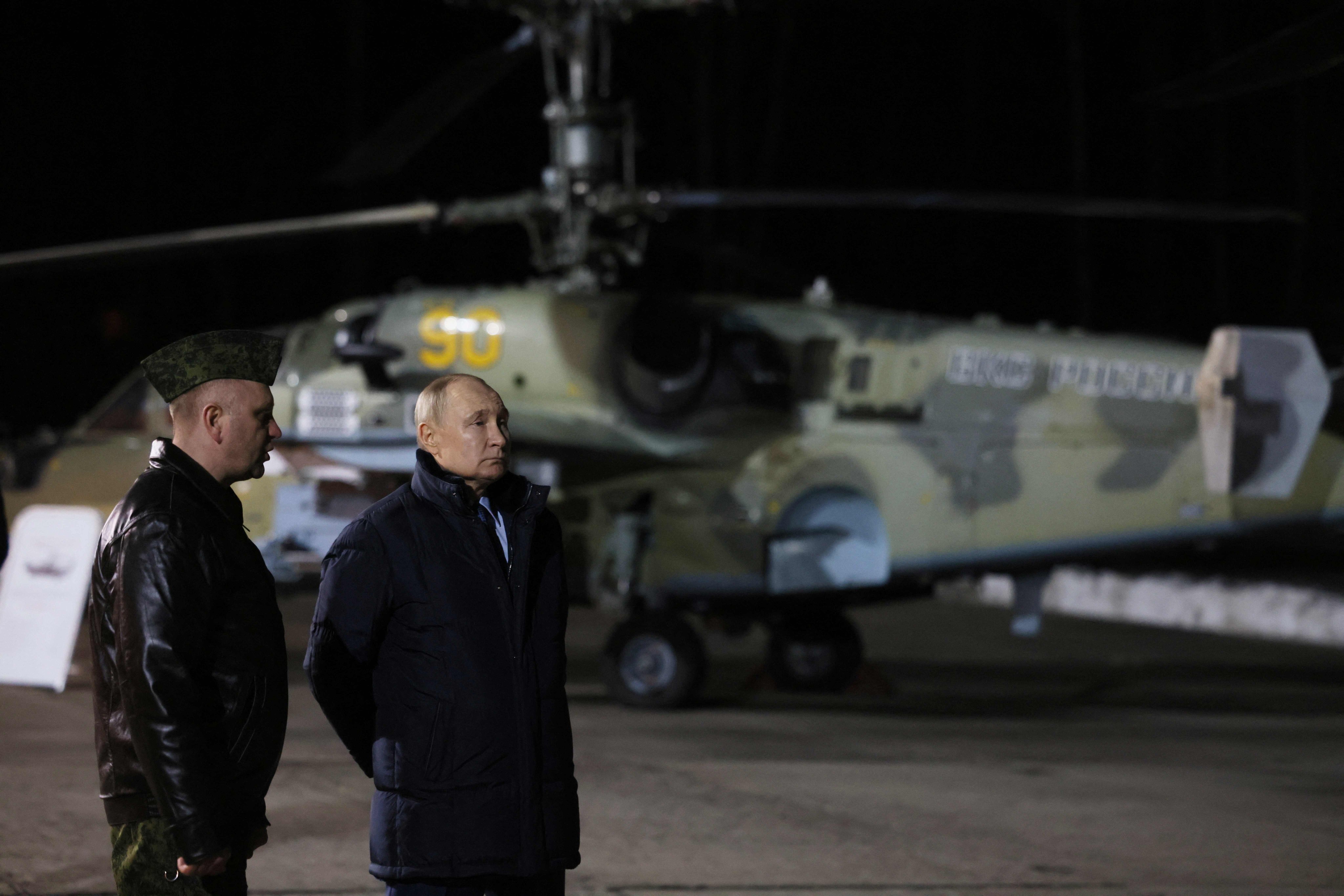 Russian President Vladimir Putin (right) visits the State Centre for Deployment and Retraining of Flight Personnel of the Russian defence ministry in Torzhok, Tver region, on March 27. Photo: AFP