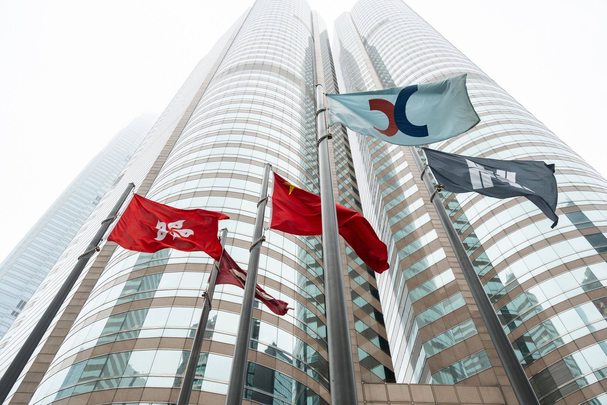 The flags of the Hong Kong Special Administrative Region and the Hong Kong Exchanges and Clearing outside the Exchange Square in Central.  Photo: Bloomberg
