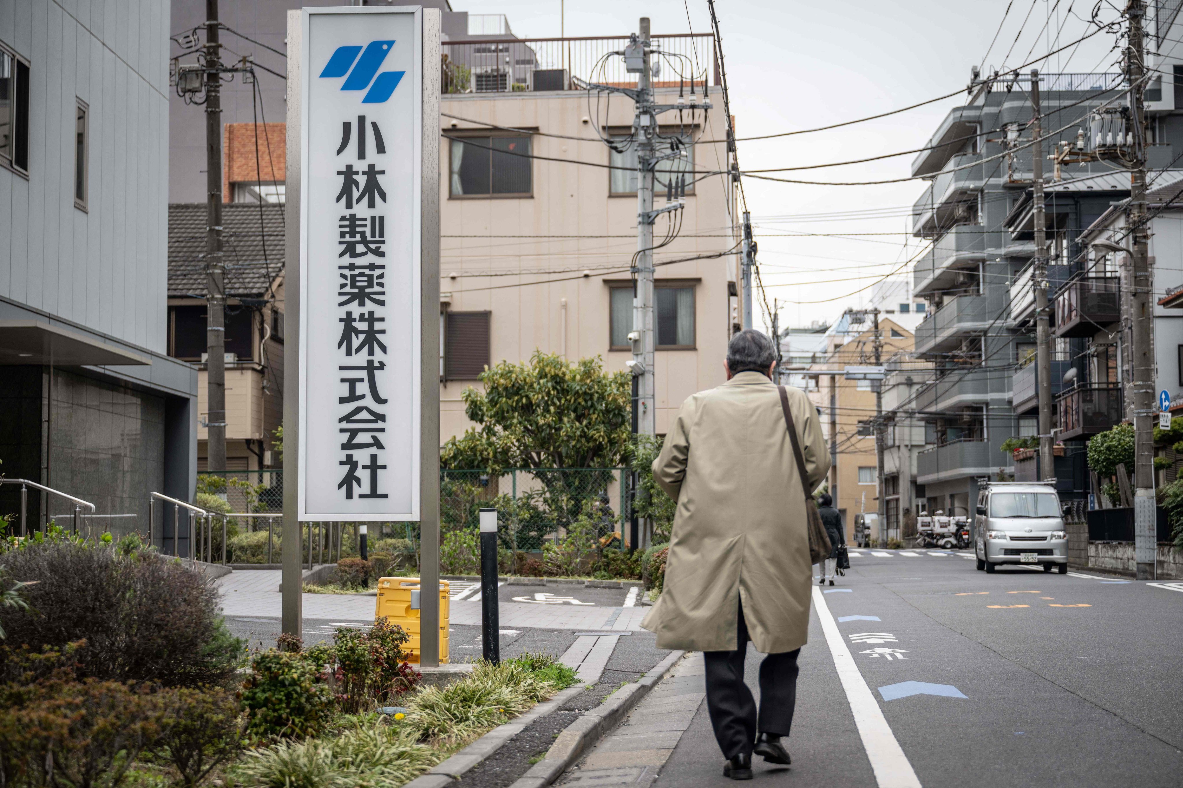A man walks past a signage of Kobayashi Pharmaceutical outside the company’s office in Tokyo on March 28. Photo: AFP