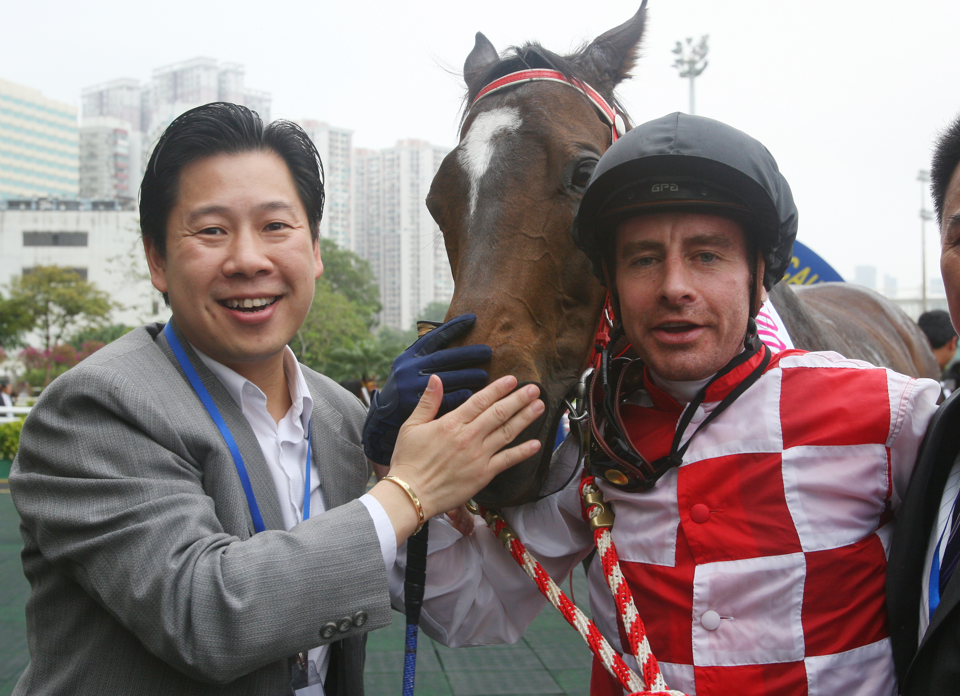 Trainer Dennis Yip celebrates his first Macau Hong Kong Trophy success with Joyful Winner and jockey Eric Saint-Martin in 2009. Photos: Kenneth Chan