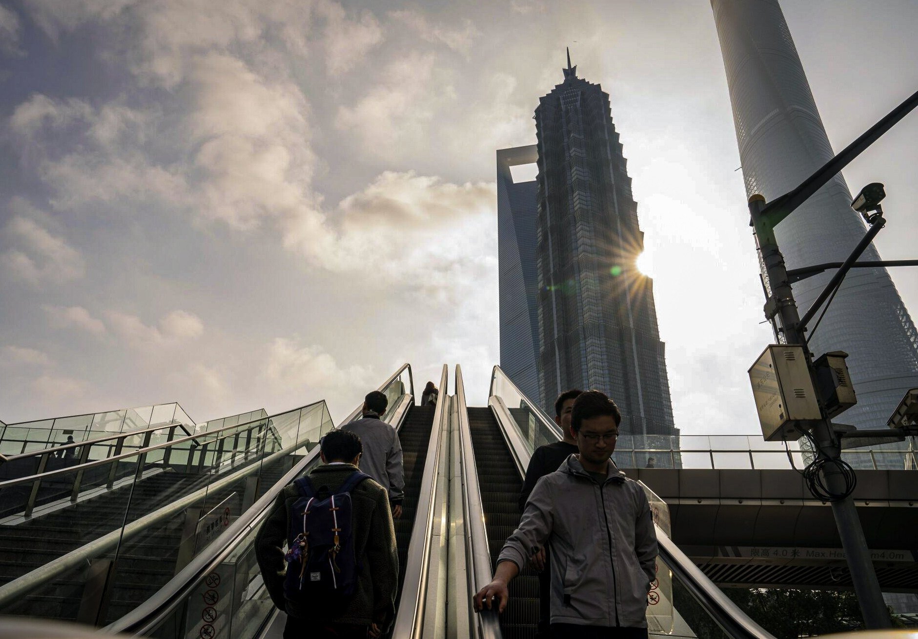Pedestrians ride escalators in Pudong’s Lujiazui financial district in Shanghai on January 29, 2024. Photo: Bloomberg