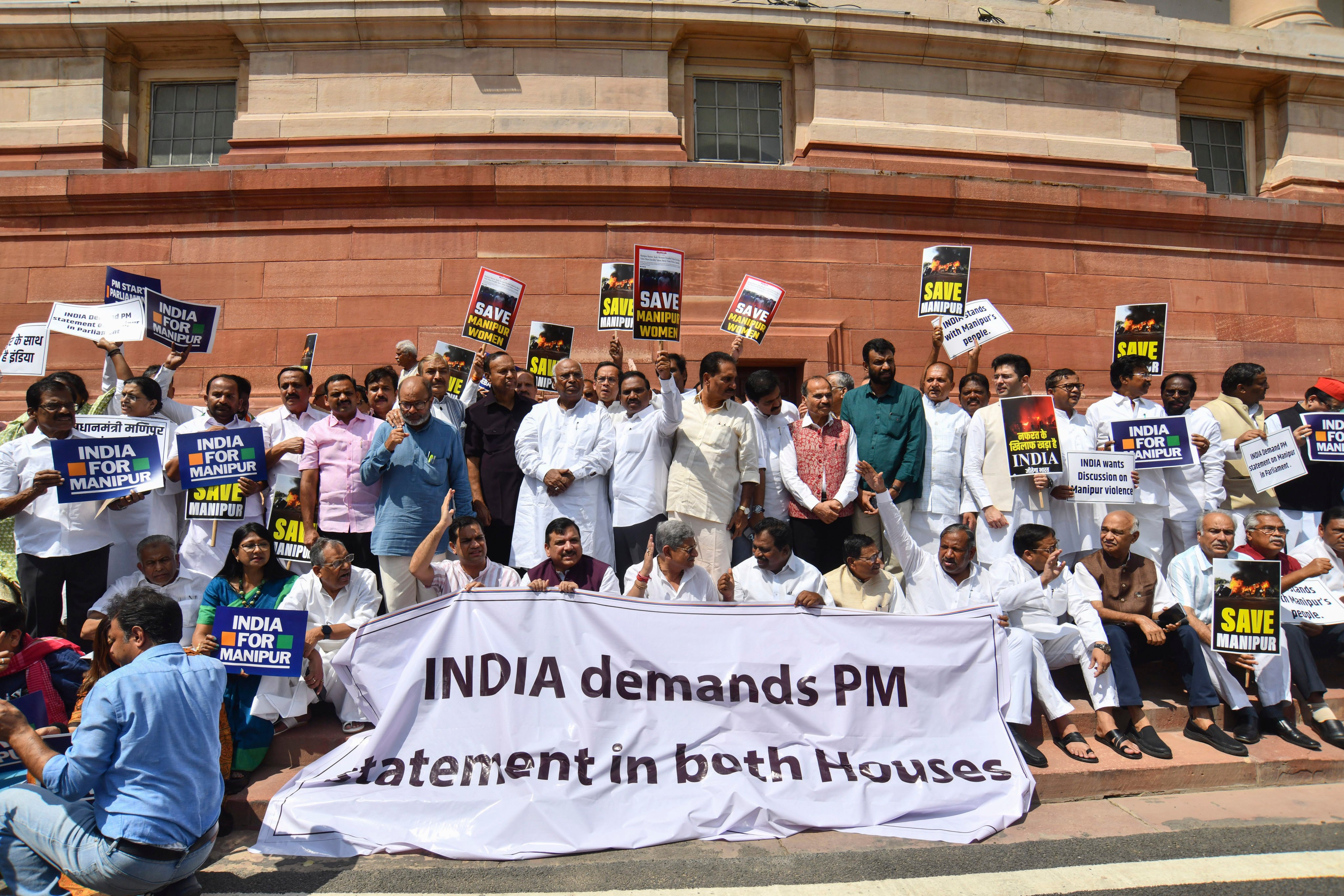 Opposition lawmakers demanding a statement from Prime Minister Narendra Modi on the violence in Manipur state outside the Parliament building in New Delhi, on July 24, 2023. Photo: AP