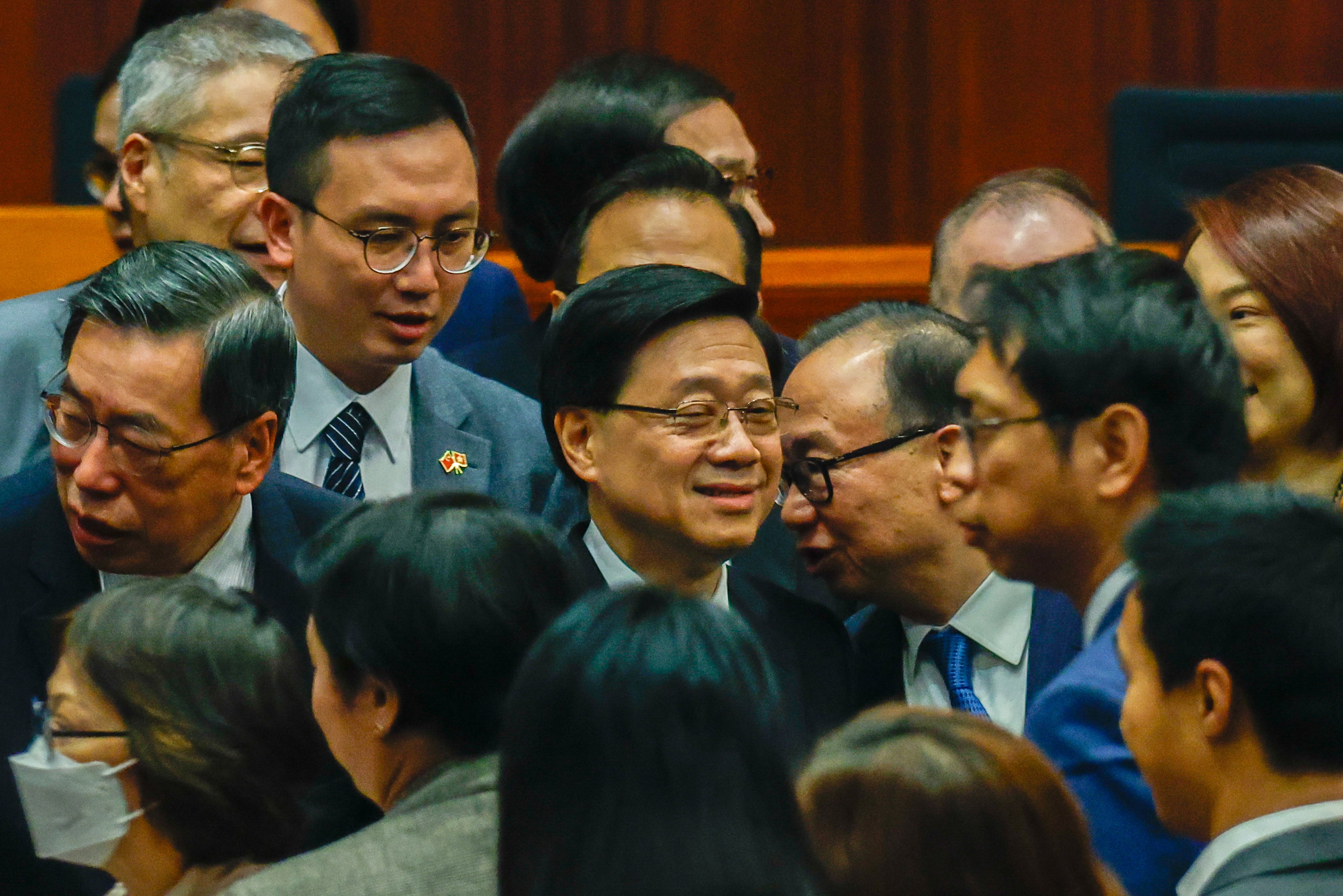 Hong Kong Chief Executive John Lee Ka-Chiu (centre) talks to lawmakers at the Legislative Council after the passage of Article 23, on March 19. After years of blaming political opposition and filibustering for a lack of progress on the issues that matter to Hongkongers, the city government no longer has any excuses for its inaction. Photo: EPA-EFE