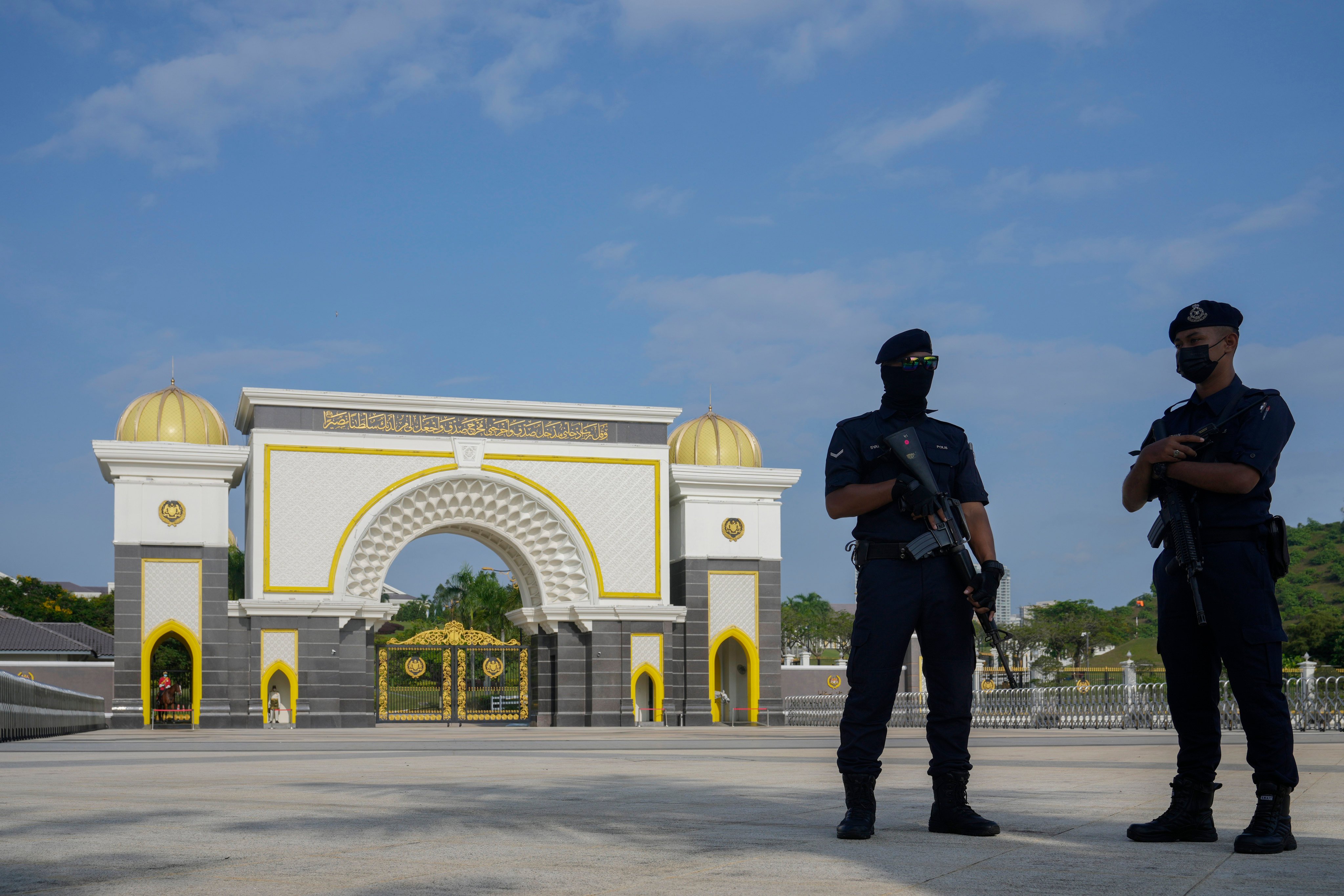 Police stand guard at the National Palace in Kuala Lumpur. Malaysia has arrested a suspected Israeli spy armed with handguns at a hotel in the capital. Photo: AP