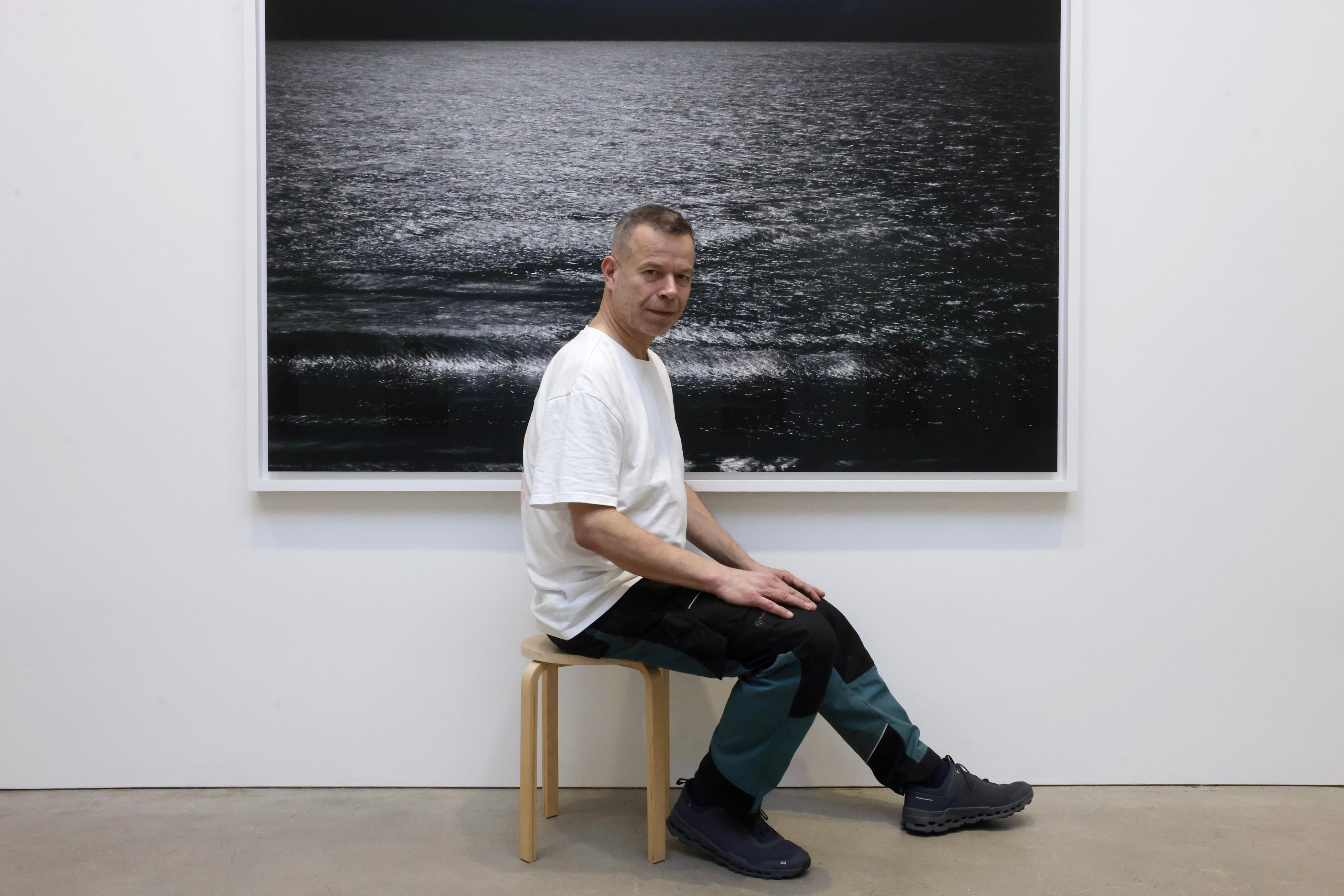 Wolfgang Tillmans with his artwork Lunar Landscape, part of The Point Is Matter at David Zwirner gallery in Central, his first solo exhibition in Hong Kong in six years. “What runs through this exhibition is a deep interest in the matter of things: this shirt, this branch, this leaf, this roadside, this ocean surface,” he says. Photo: Jonathan Wong