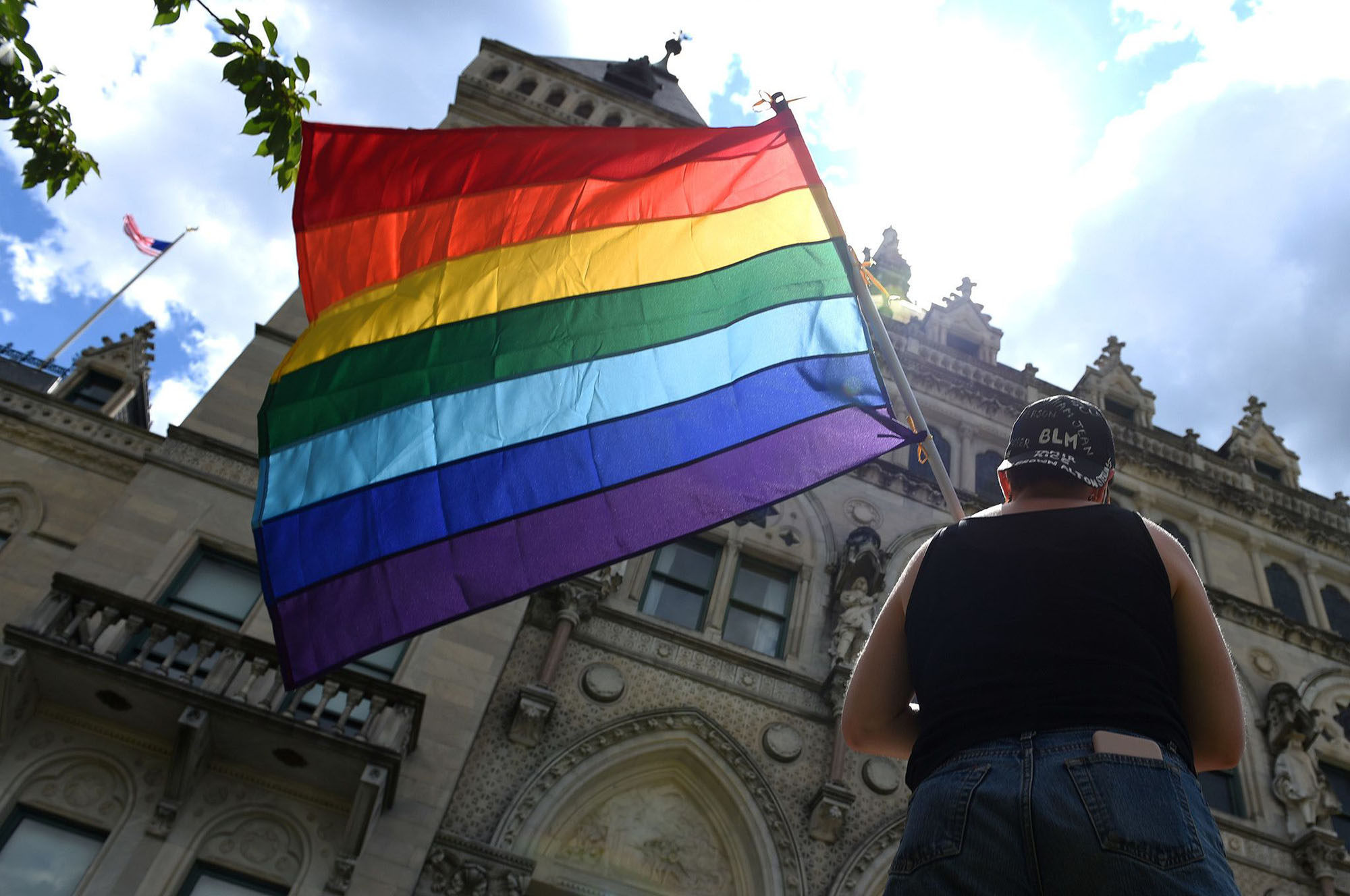 A pride flag is held at a Black Queer Trans Lives Matter rally outside the State Capitol in Connecticut. Photo: TNS