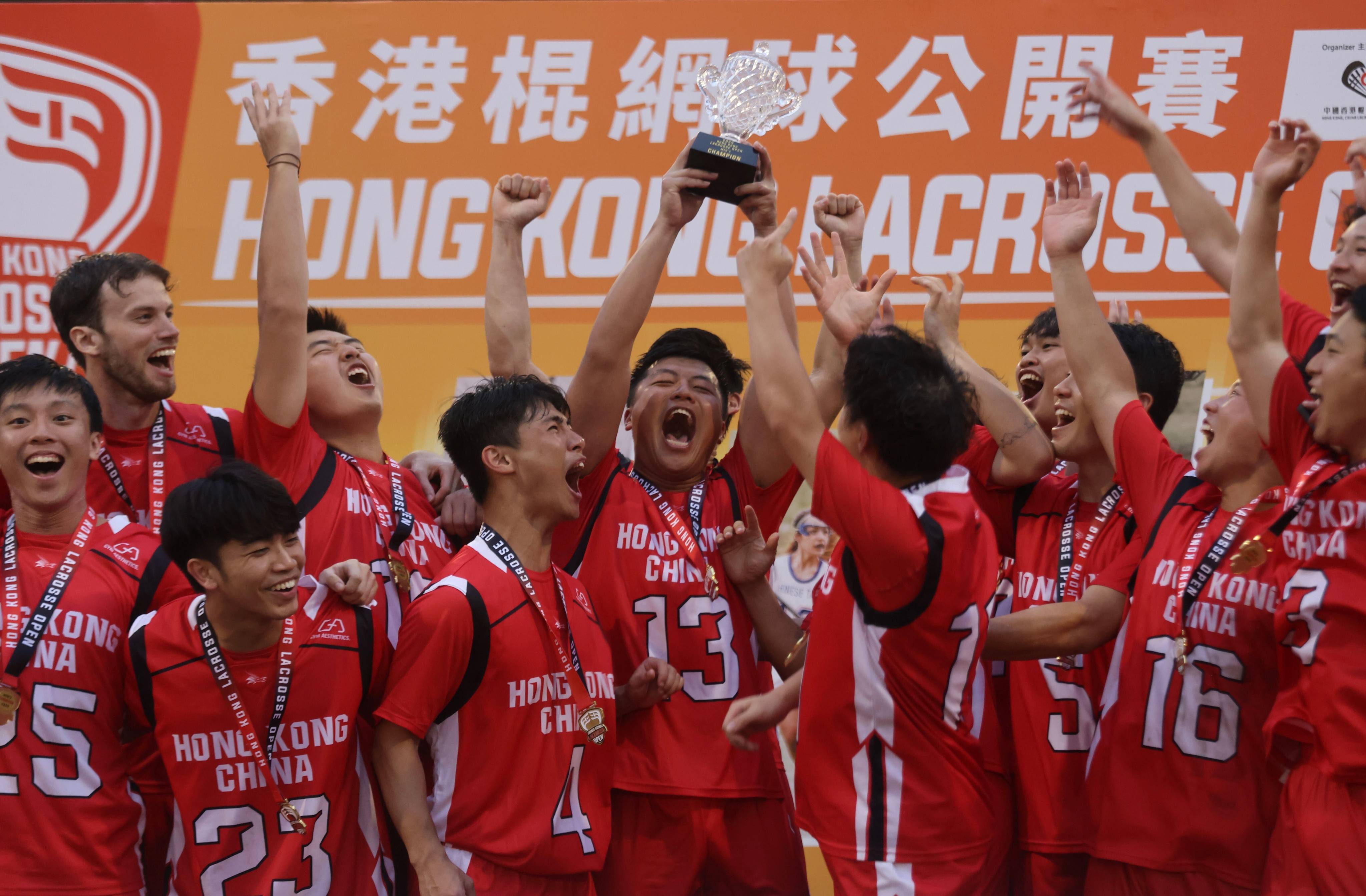 Hong Kong’s men celebrate winning the city’s Lacrosse Open at HKU Stanley Ho Sports Centre. Photo: Jonathan Wong