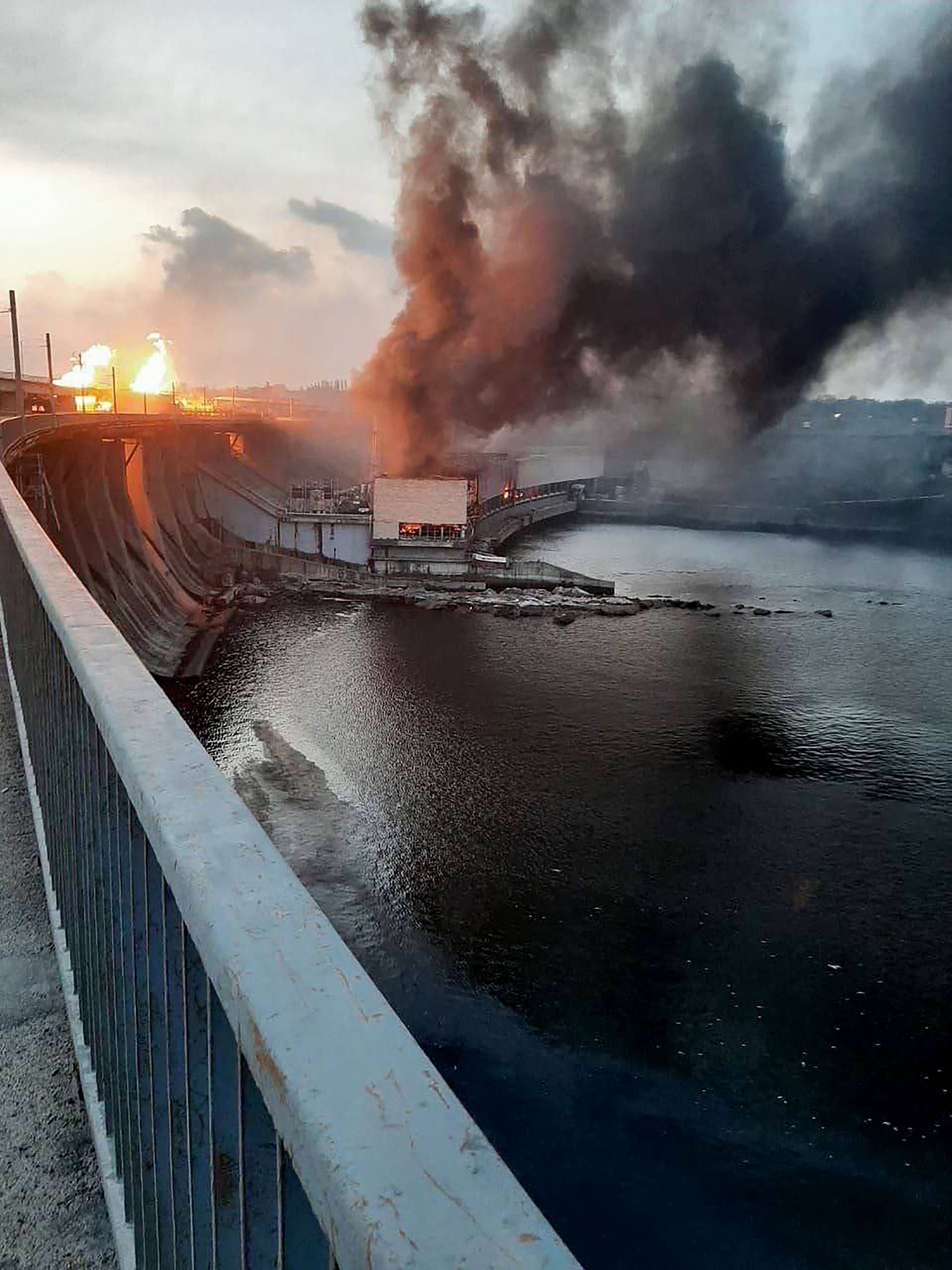 Smoke and fire rise over the dam of the Dnipro hydroelectric power plant after a missile attack in March in Zaporizhzhia, Ukraine. Photo: Prime Minister Denis Shmyhal’s office via AFP