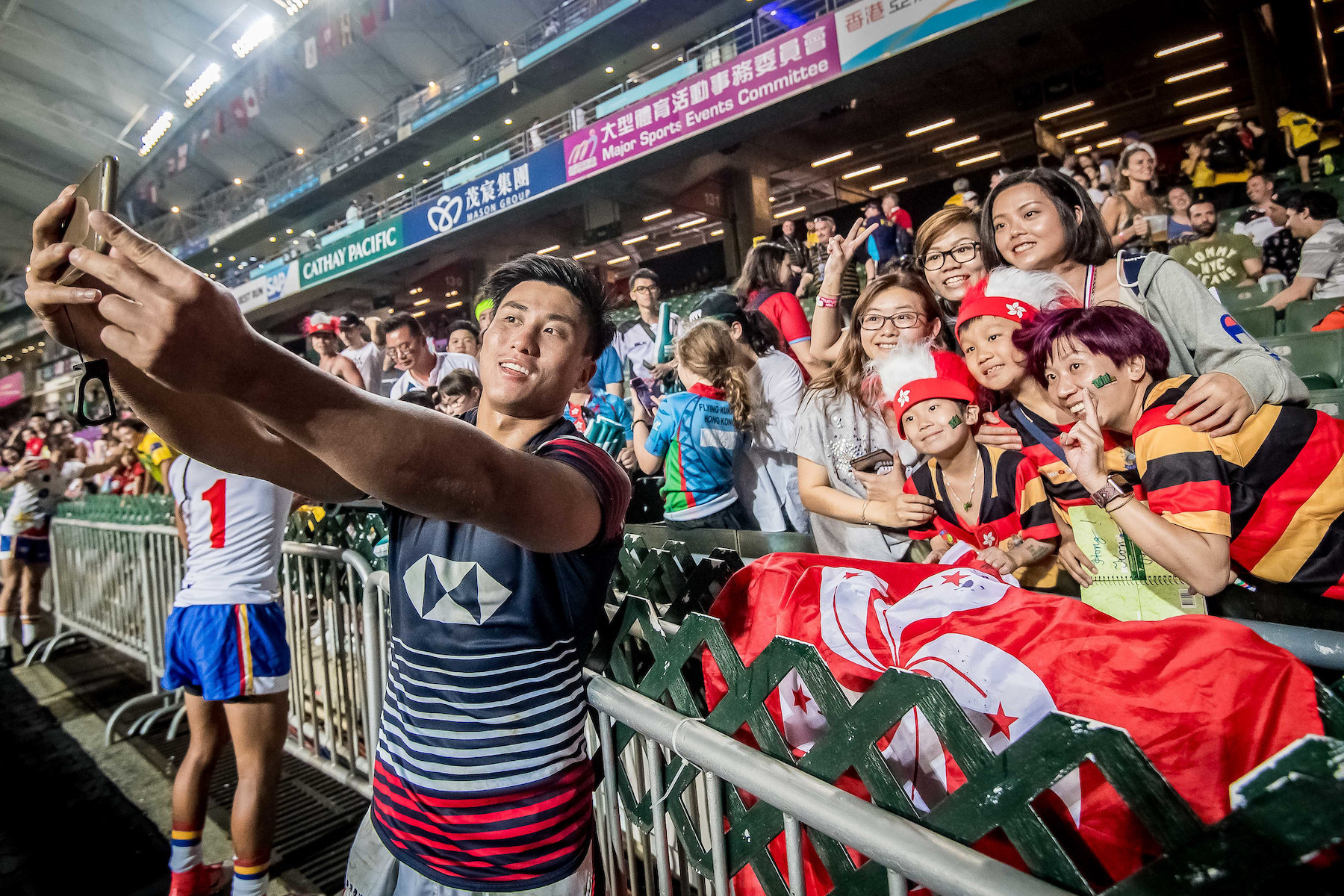 Cado Lee takes a selfie with fans at the 2019 Sevens. Photo: Ike Images for Hong Kong Rugby Union