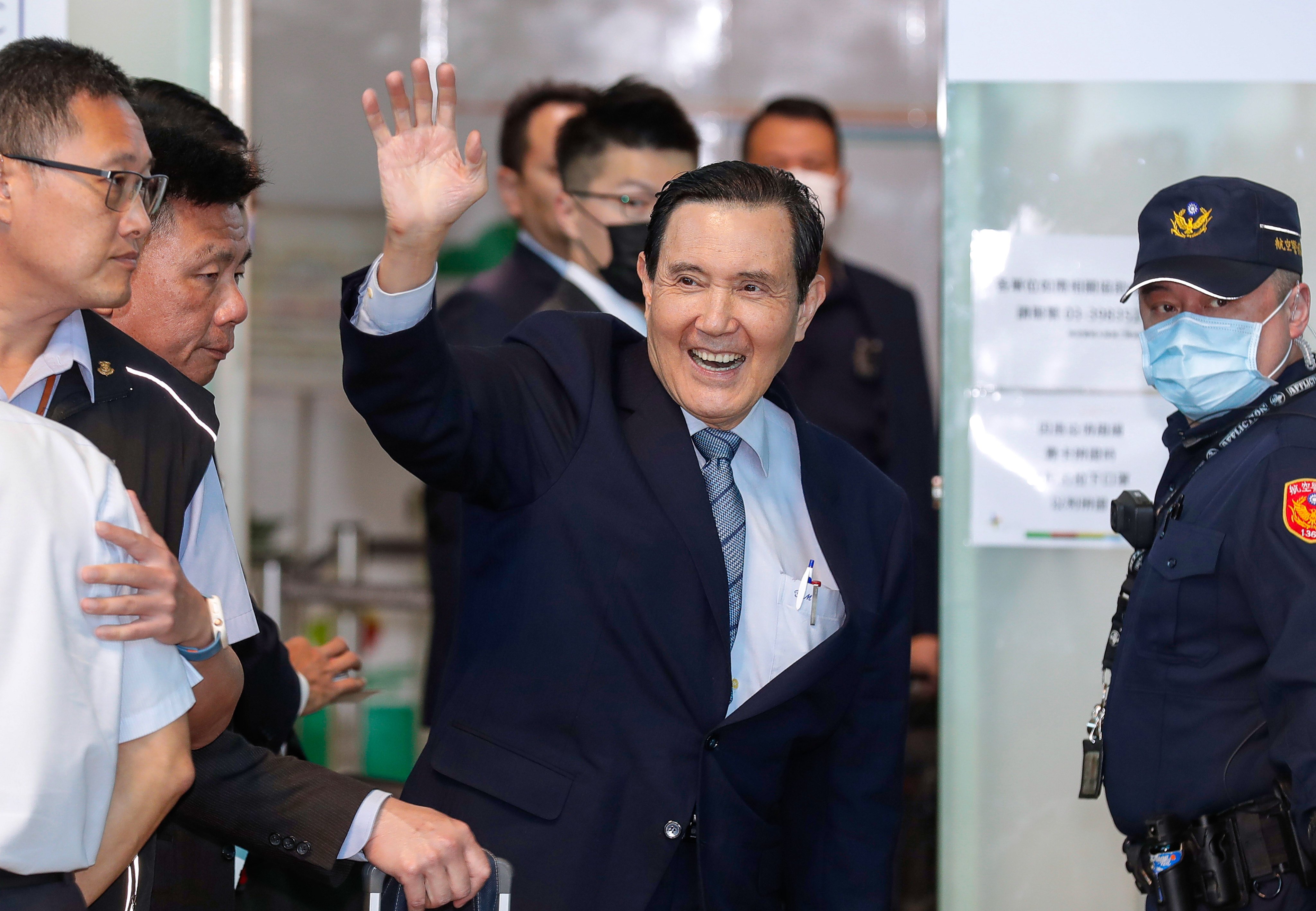 Former Taiwanese president Ma Ying-jeou waves from the Taoyuan International Airport as he leaves for an 11-day trip to mainland China on Monday. Photo: AP
