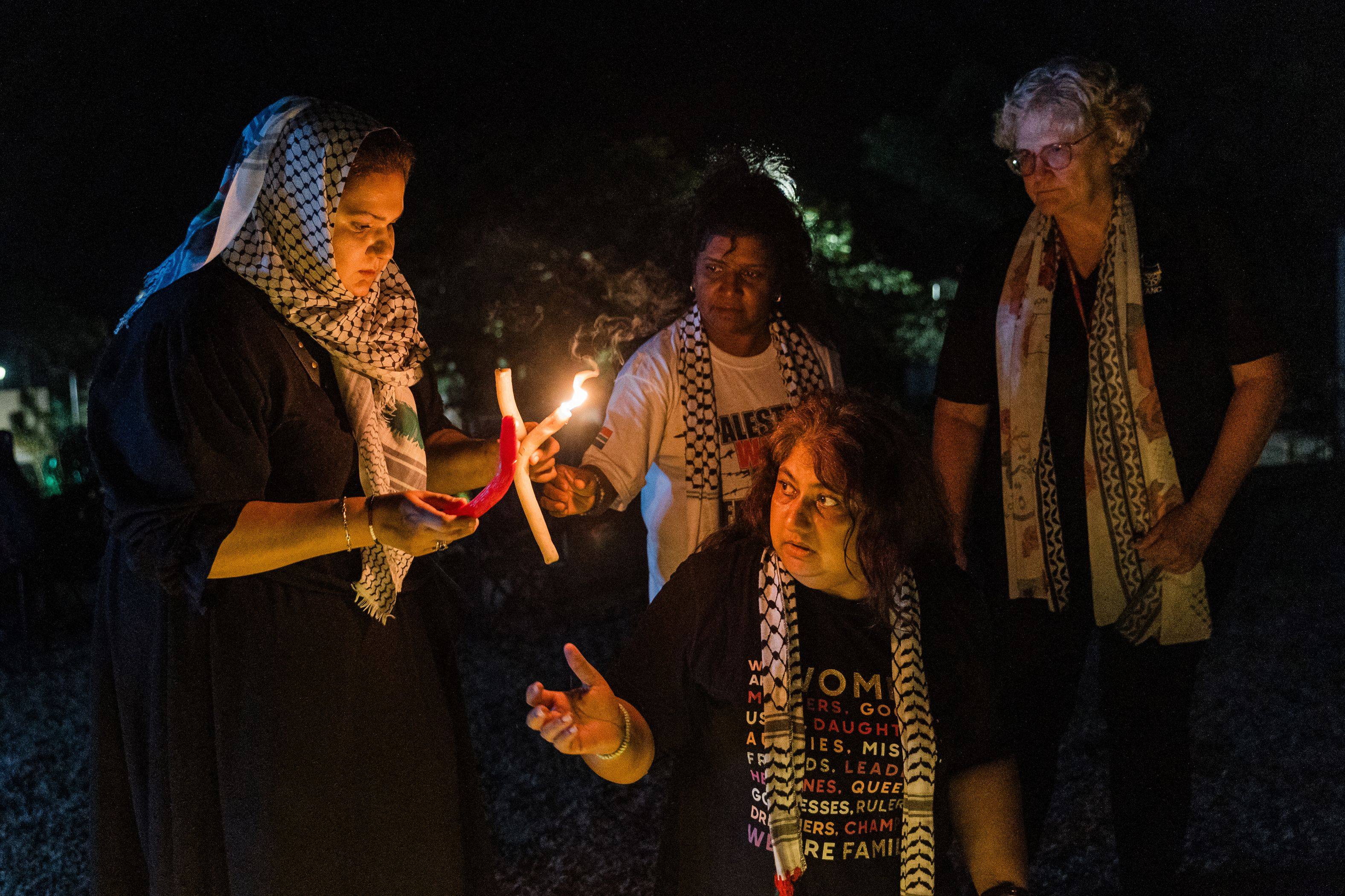 Supporters of Palestinians light candles during a 12-hour night vigil at St Michael’s Anglican church calling for an immediate ceasefire in Gaza and condemning Israel for its continued defiance of the International Court of Justice’s provisional measures in Durban, South Africa, on March 8. Photo: AFP