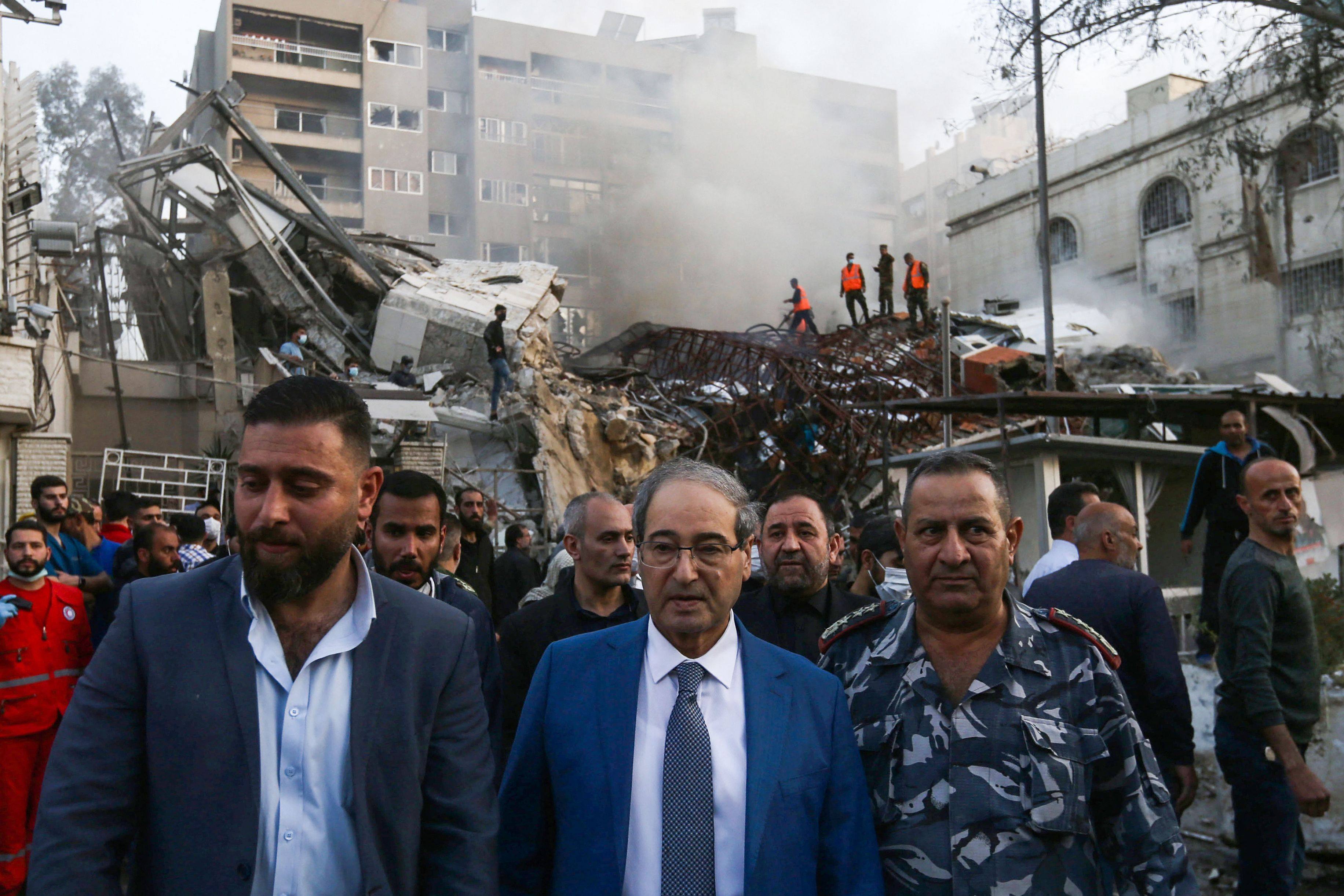 Syrian Foreign Minister Faisal Miqdad, pictured at the site of the attack, which he described as “henious”. Photo: AFP