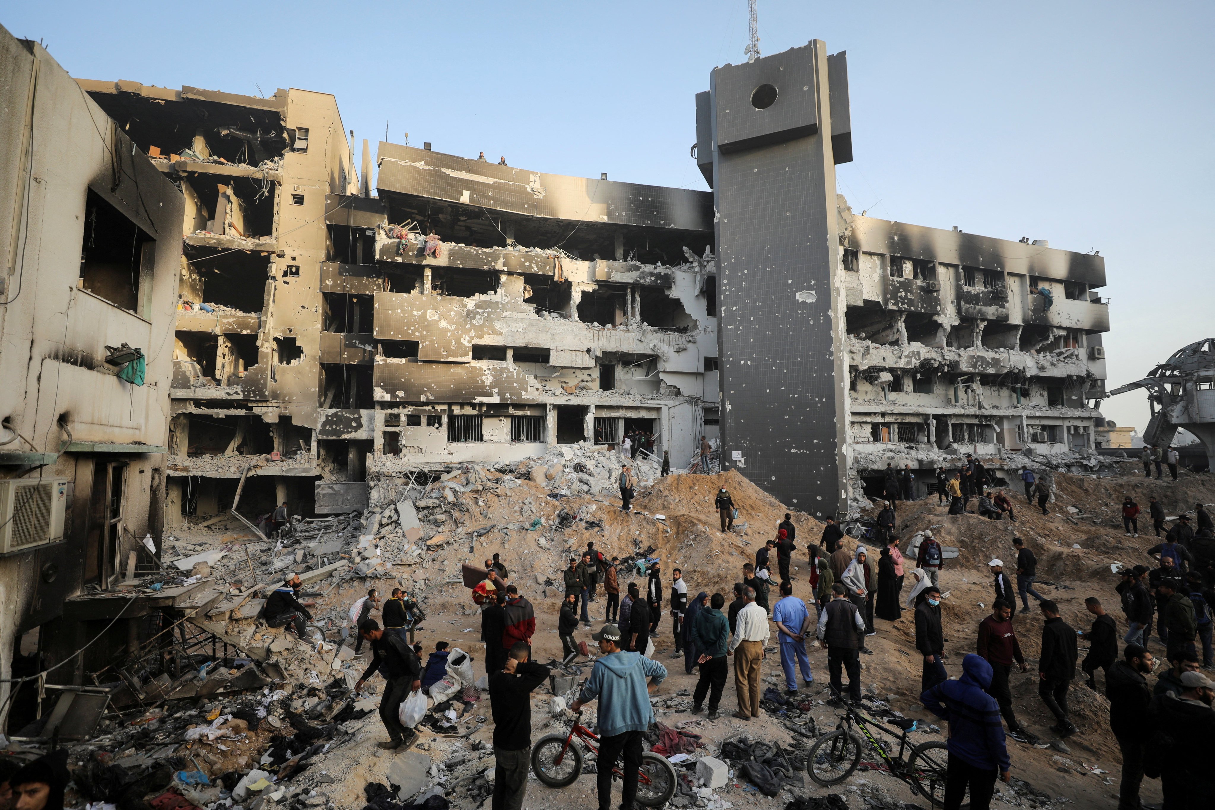 Palestinians inspect the damage at Gaza’s al-Shifa hospital after Israeli forces withdrew from the area on Monday. Photo: Reuters 