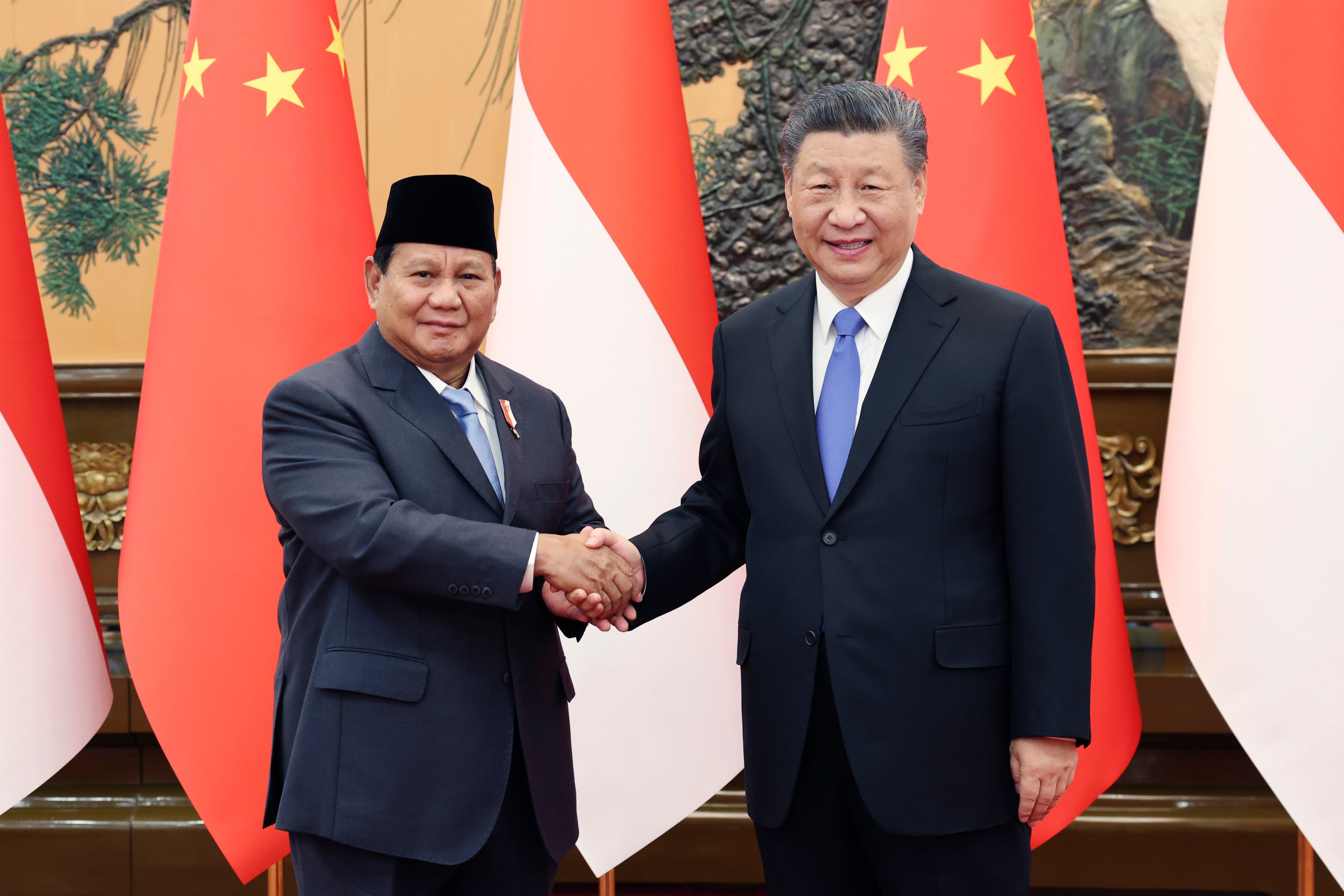 Indonesia’s president-elect Prabowo Subianto (left) shakes hands with Chinese President Xi Jinping at the Great Hall of the People in Beijing on Monday. Photo: Xinhua via AP