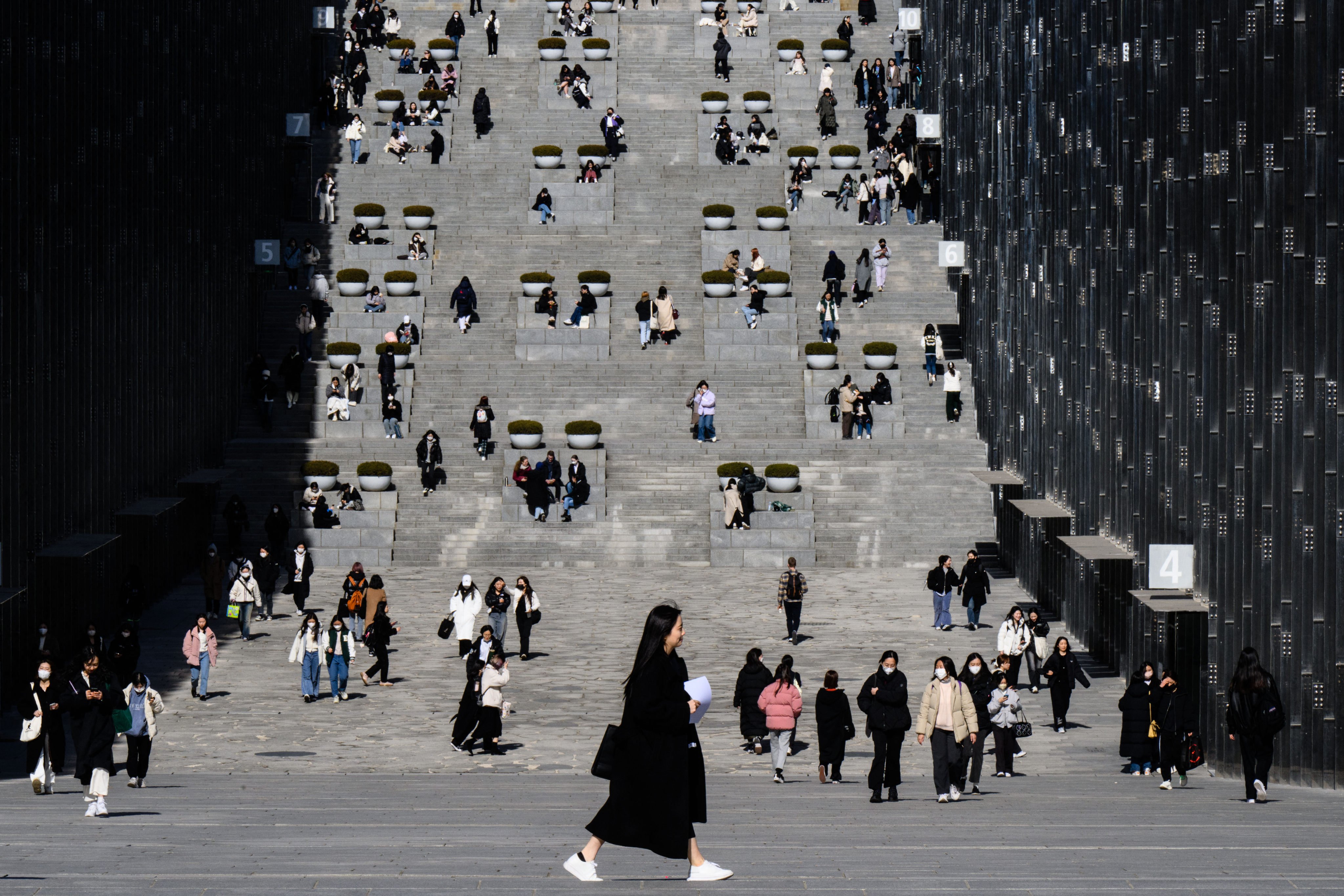 Students and visitors walk around the campus of Ewha Womans University in Seoul in March 2023. Photo: AFP