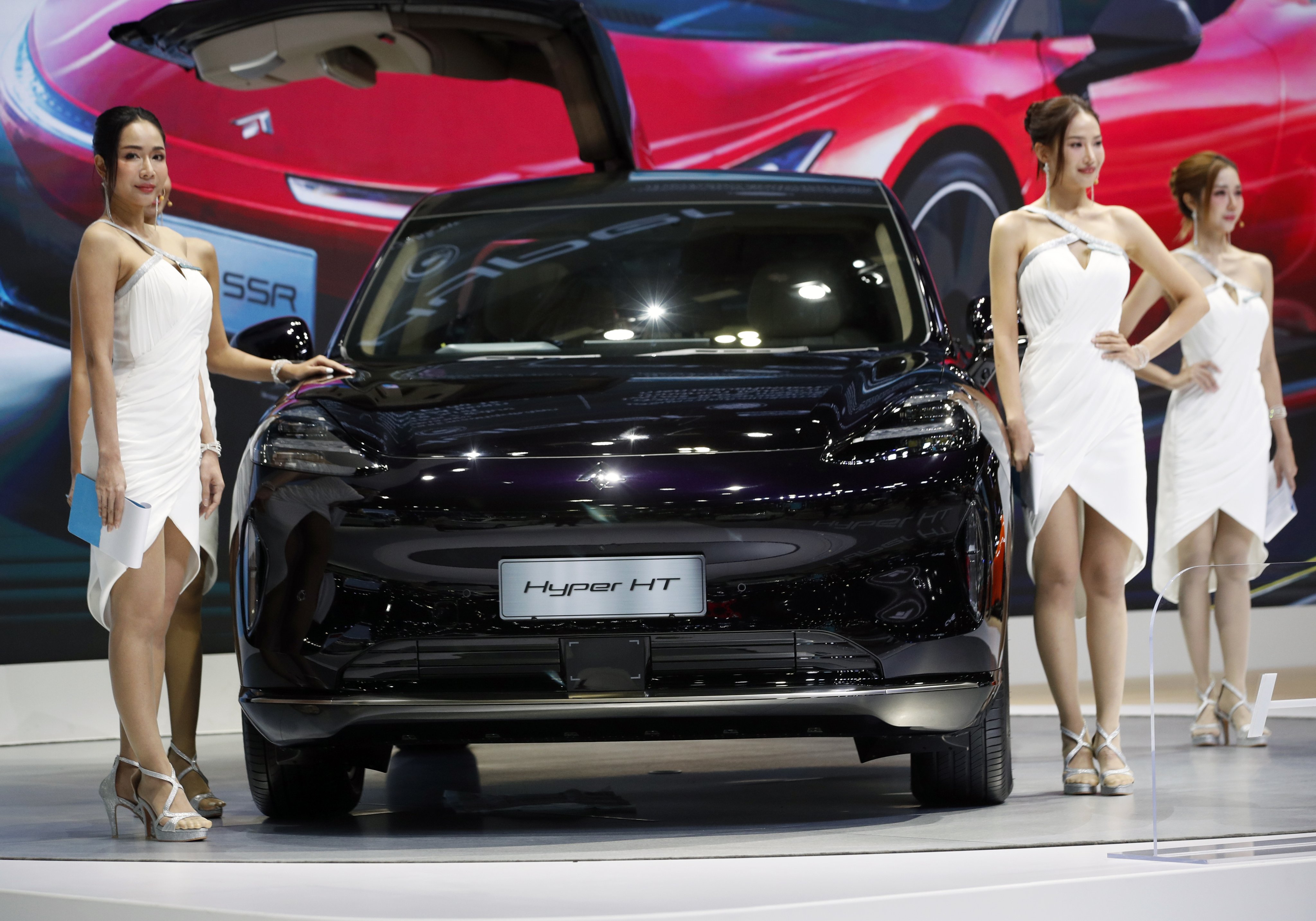 Models present Chinese automaker GAC’s Aion Hyper HT at the 45th Bangkok International Motor Show 2024 in Nonthaburi province on the outskirts of Bangkok, on March 28, 2024. Photo: EPA-EFE