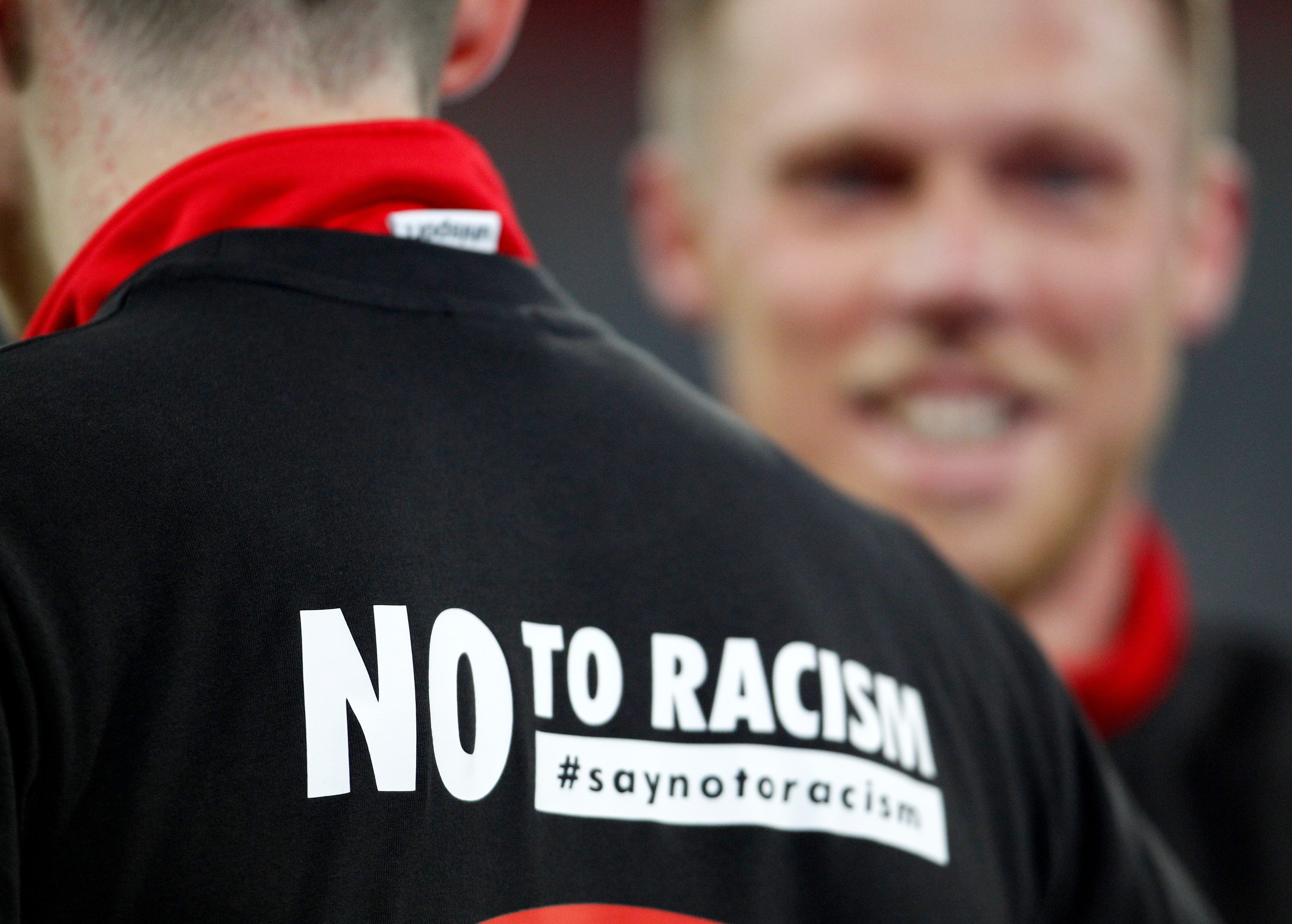 The message “No to Racism” is written on the warm-up shirt of a Düsseldorf player ahead of the German 2nd Bundesliga match between Fortuna Duesseldorf and VfL Bochum at the Merkur Spiel-Arena. Photo: DPA