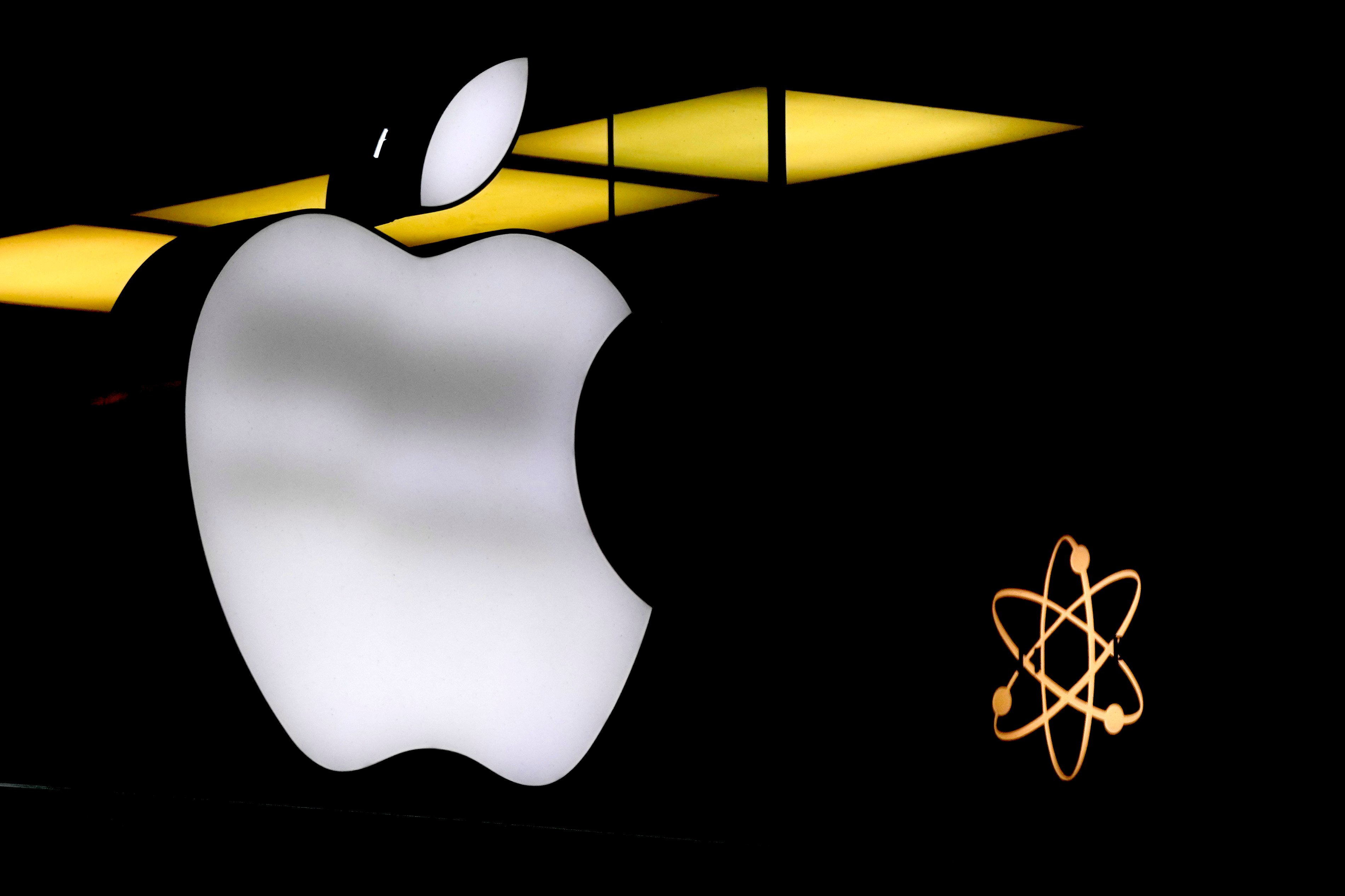 The Apple logo illuminated at a store in Munich, Germany, on November 13, 2023. Photo: AP