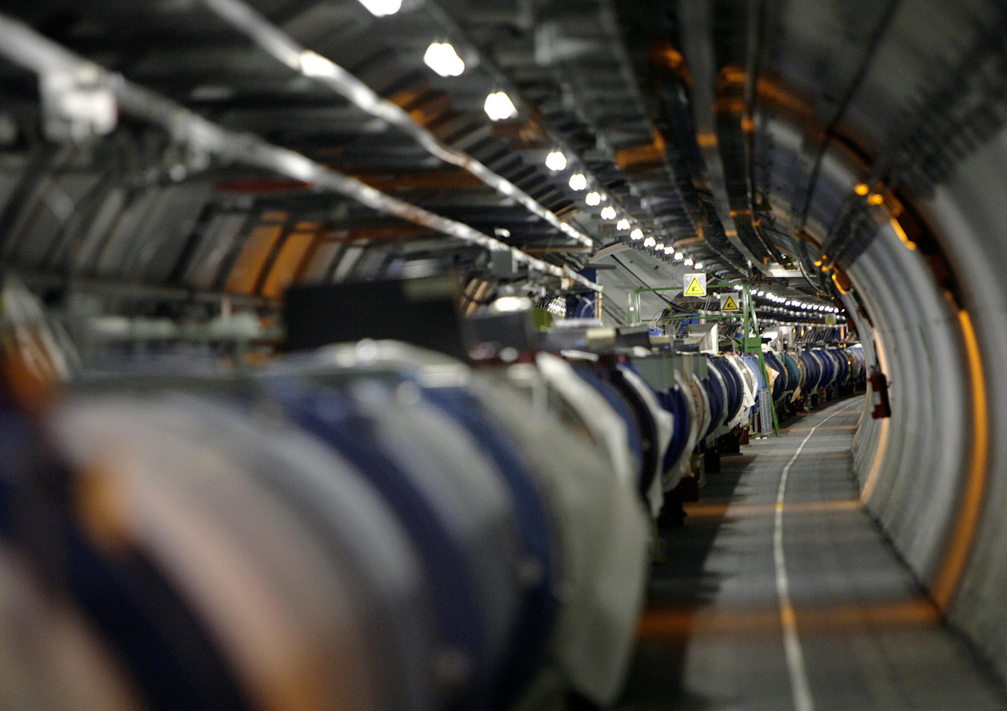 The Large Hadron Collider near Geneva, Switzerland, sends beams of protons around its 27km loop at 99.99 per cent the speed of light. Photo: Keystone via AP