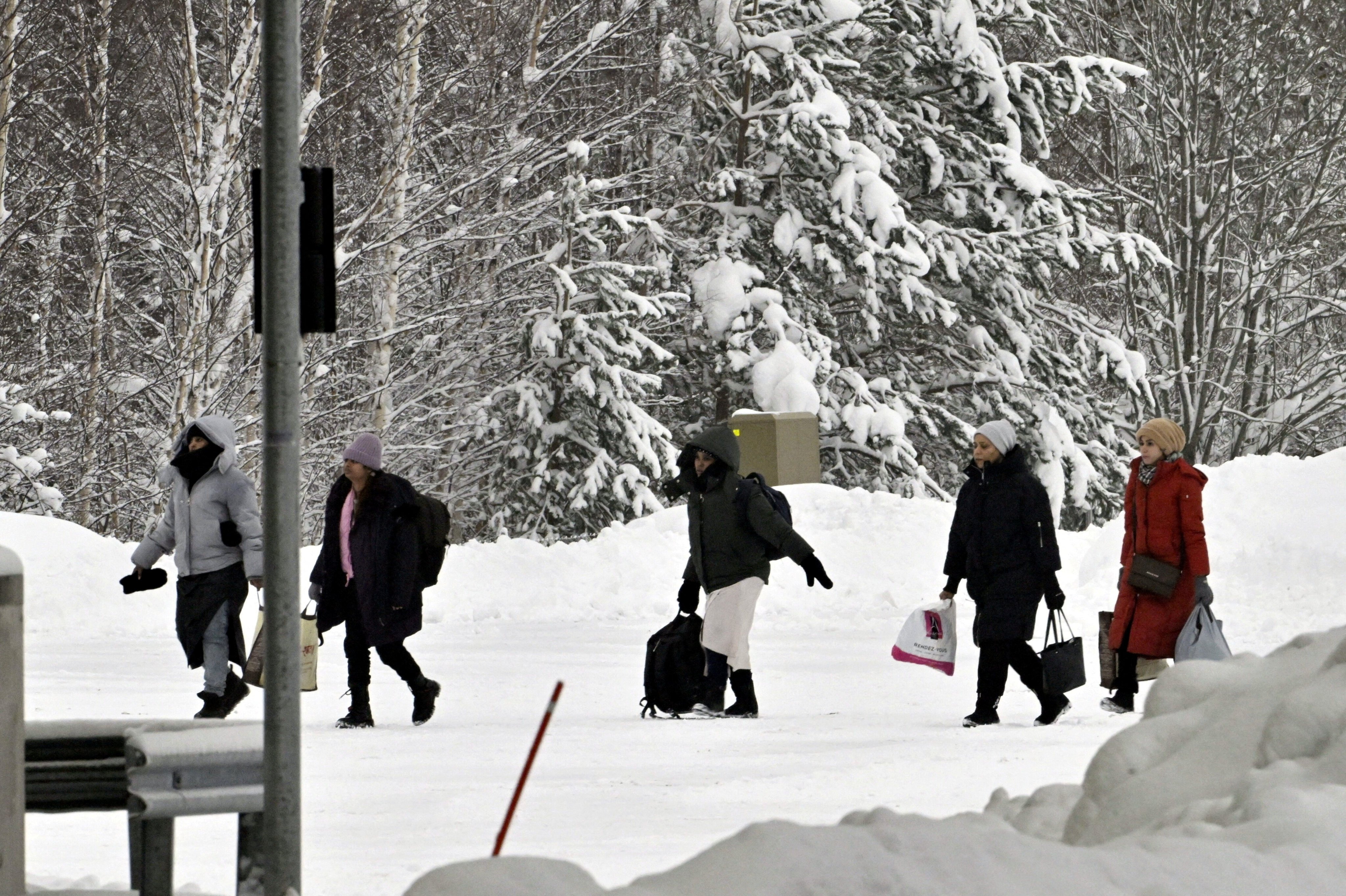 Migrants arrive at the Vaalimaa border check point between Finland and Russia. Finland closed the border in mid-December after nearly 1,000 migrants arrived without a visa through its border crossings with Russia since August. Photo: Reuters