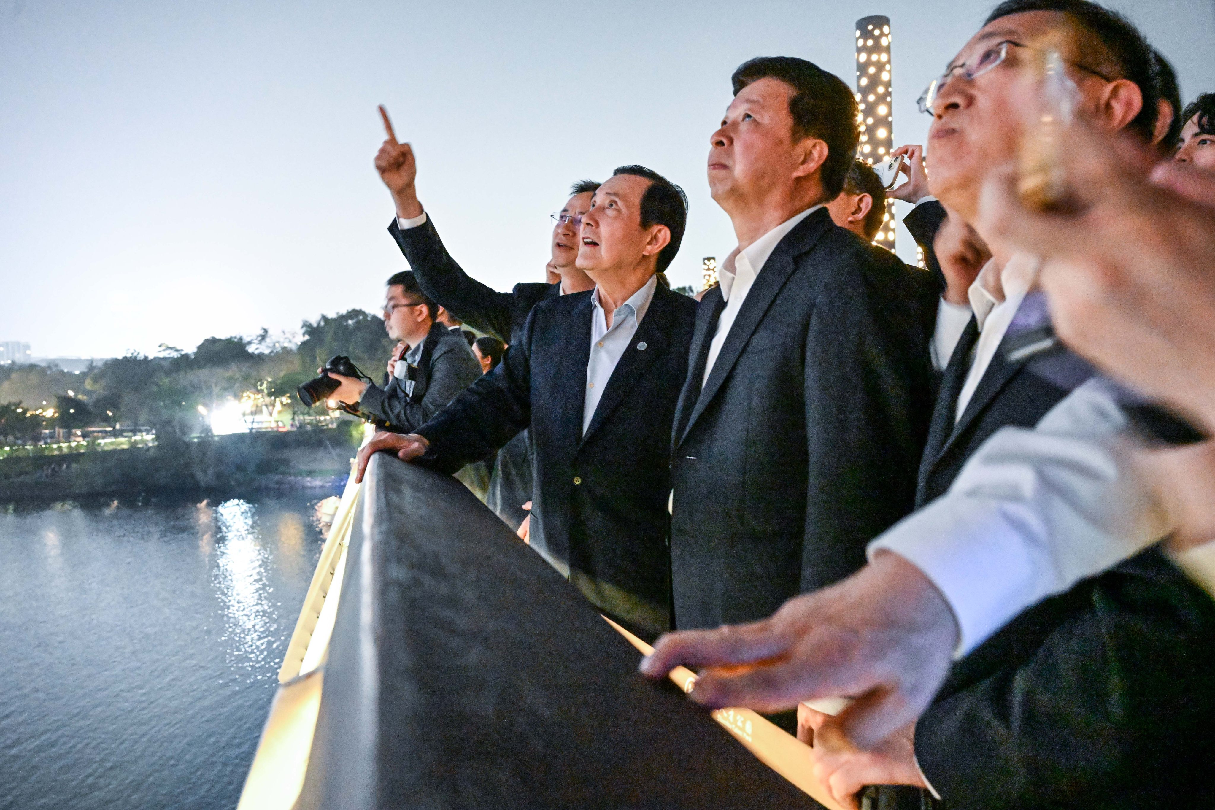 Members of a delegation from Taiwan led by Ma Ying-jeou watch a drone show at Shenzhen Talent Park on April 1. Photo: Xinhua 