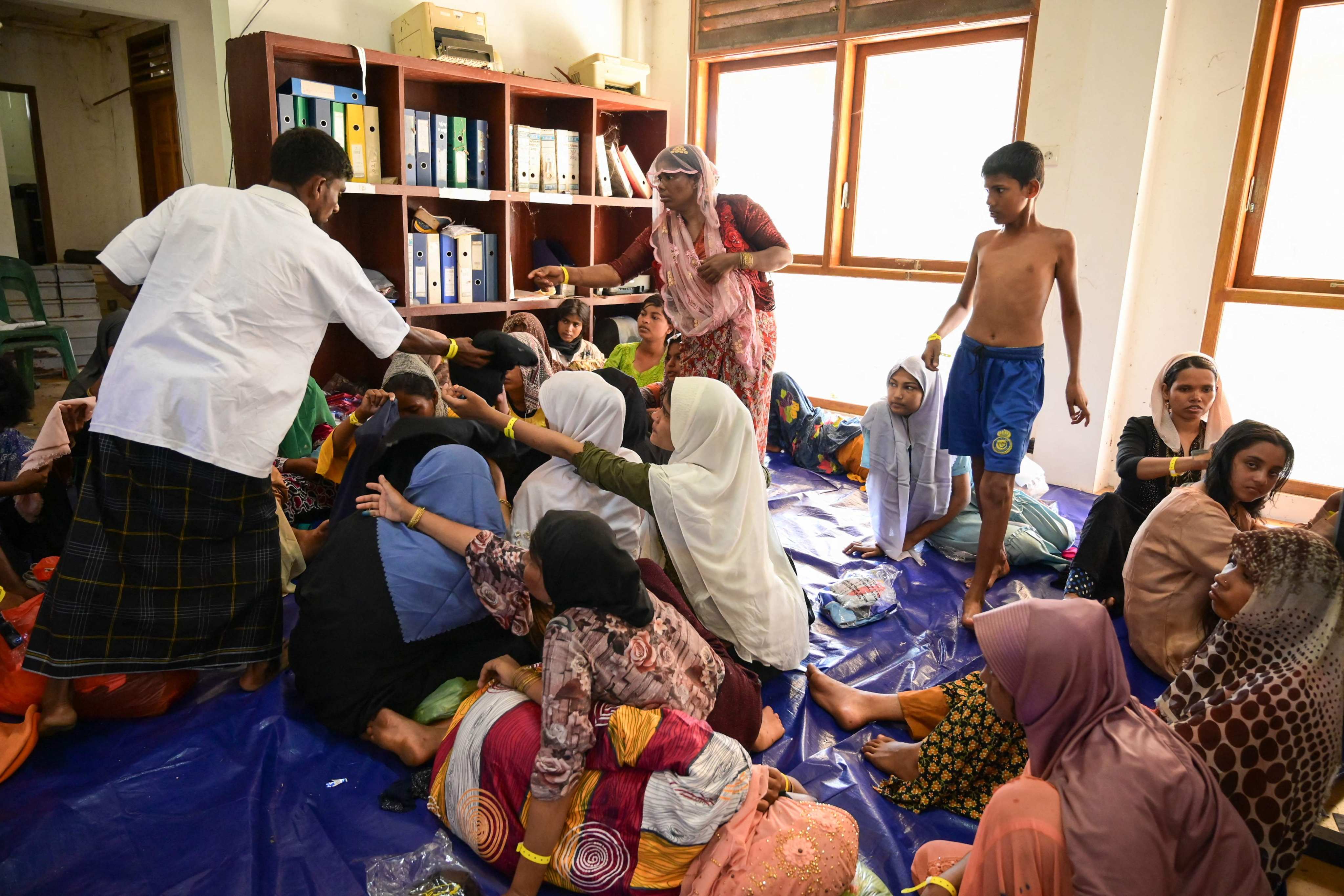 Newly arrived Rohingya refugees rest at the former Red Cross Indonesia office building in Meulaboh, West Aceh, on March 22. Photo: AFP
