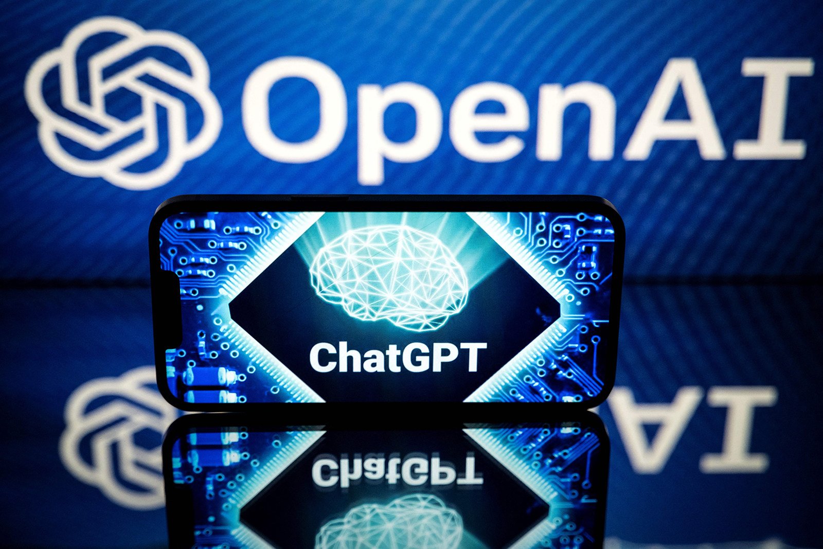 The logos of OpenAI and ChatGPT shown on a smartphone on January 23, 2023, Photo: AFP