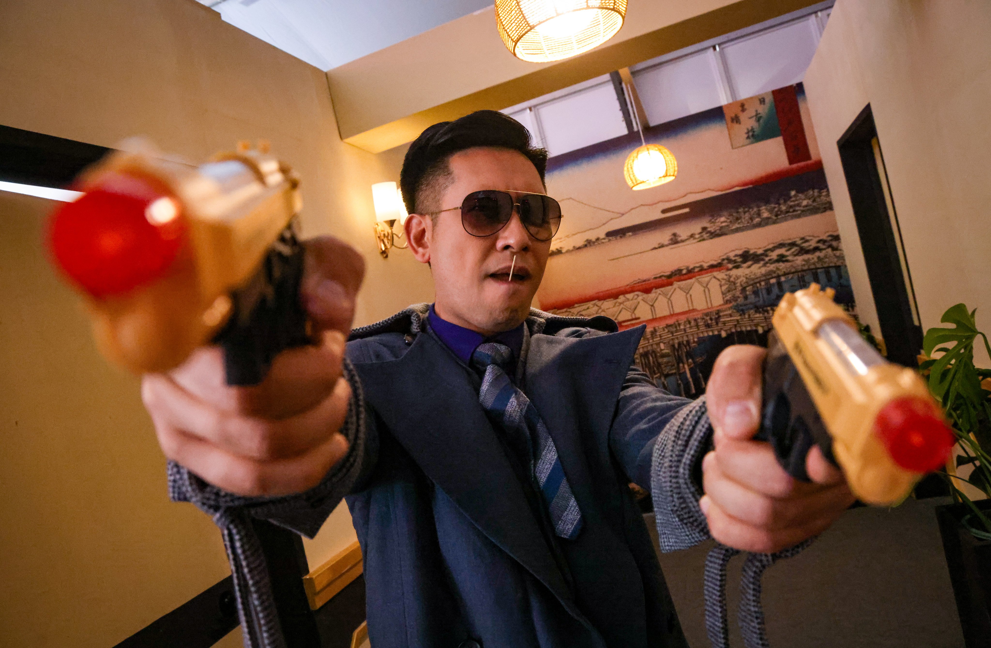 An actor recreates a scene from the classic Hong Kong film A Better Tomorrow as part of a promotional event for the festival. Photo: Dickson Lee