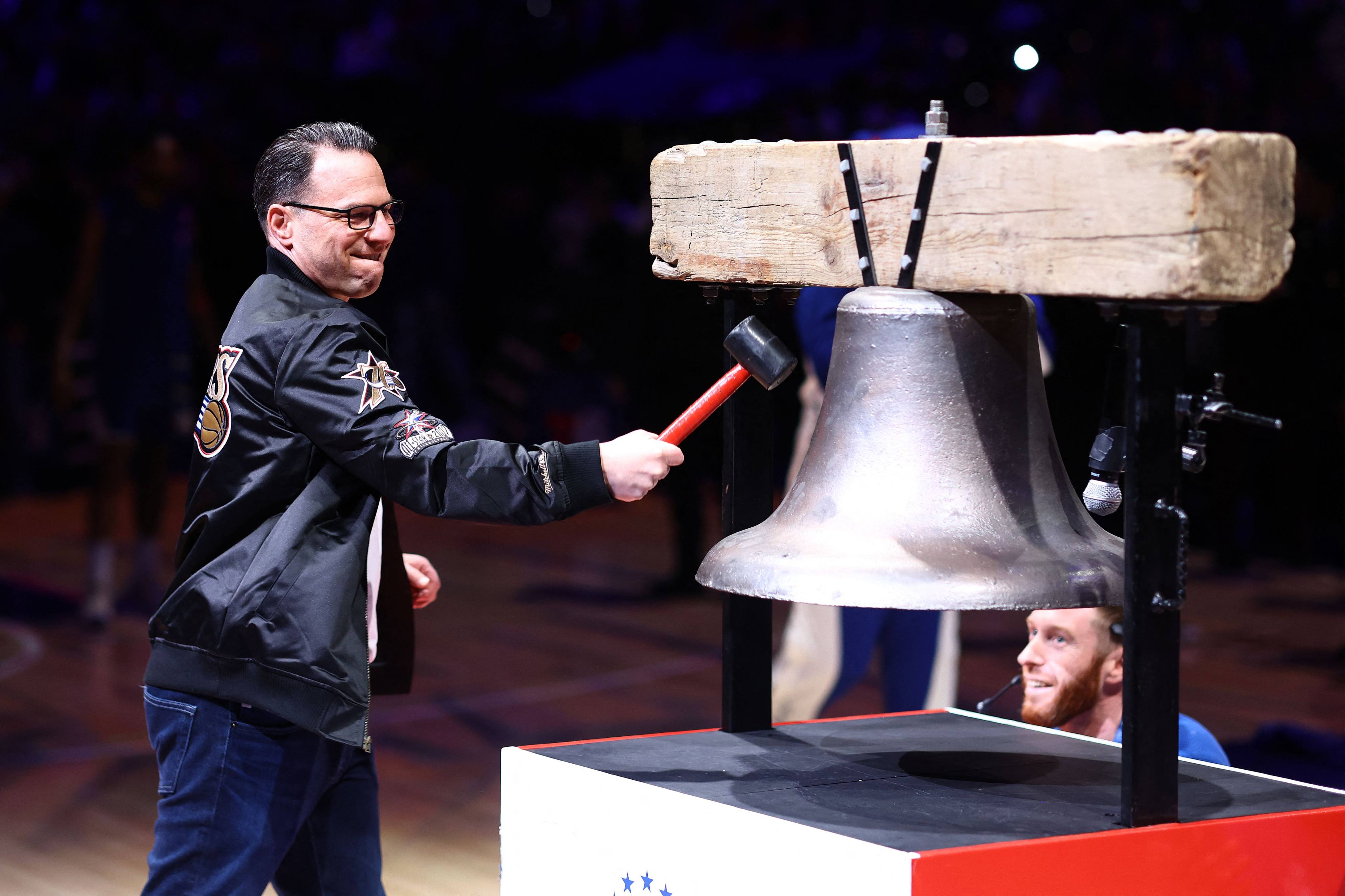 Pennsylvania Governor Josh Shapiro, a prolific Tik Tok poster, rings the bell before a basketball game in Philadelphia on March 18. Photo: Getty Images via AFP