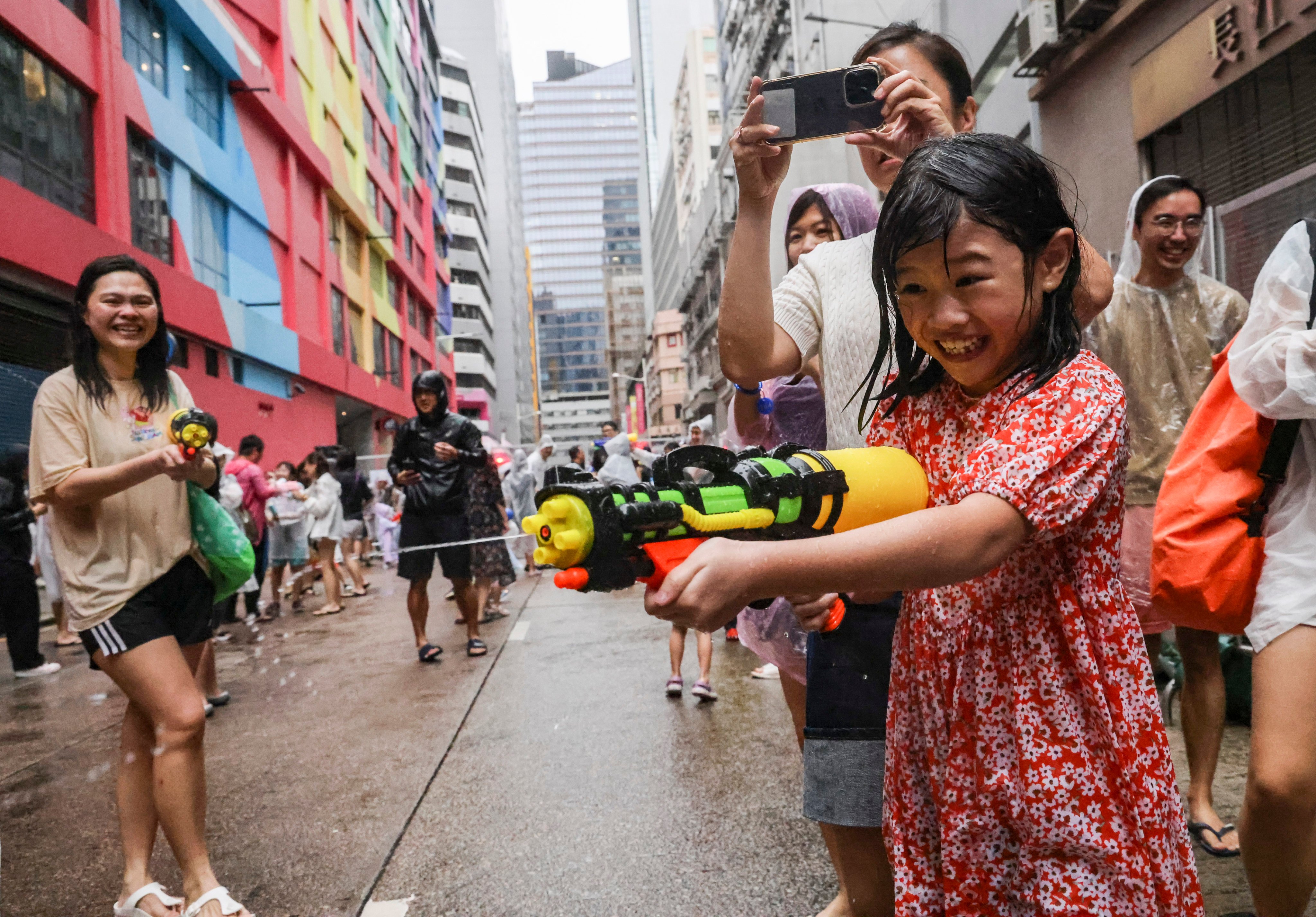 A youngster makes a splash in Lai Chi Kok on Saturday. Photo: Dickson Lee