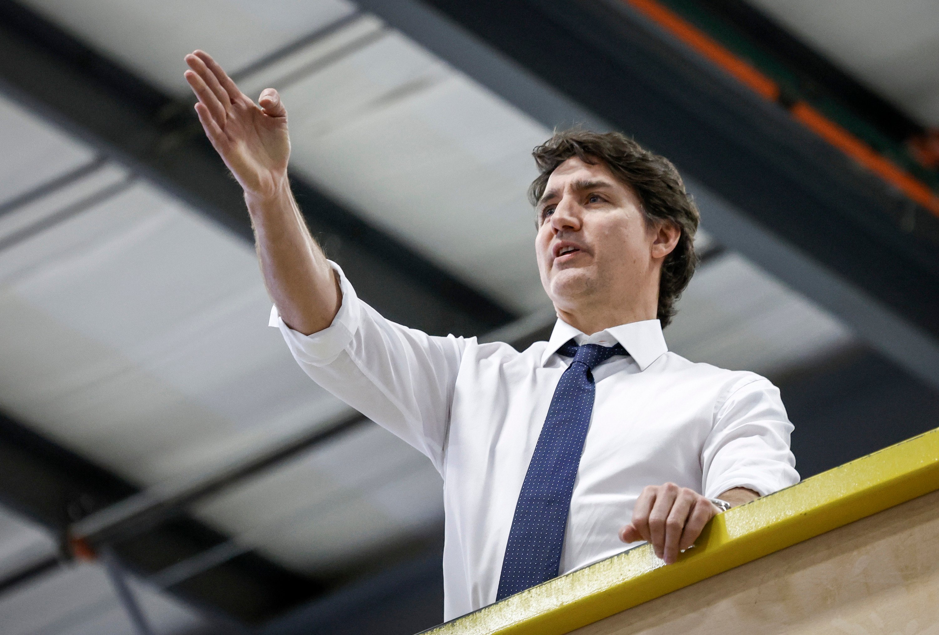 Canadian Prime Minister Justin Trudeau tours a modular home construction facility before making a housing announcement in Calgary, Alberta, on Friday. Photo: Canadian Press via AP