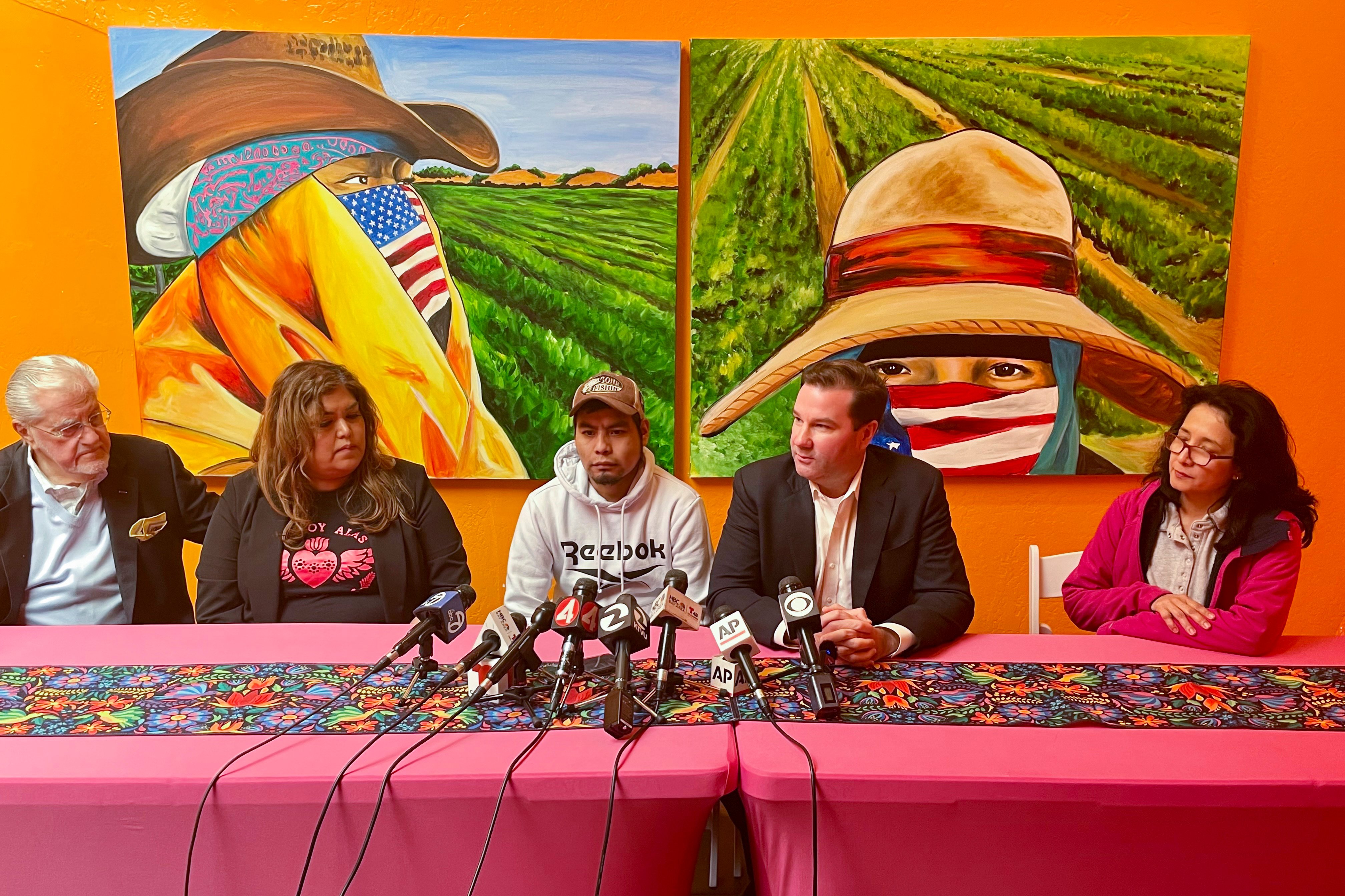 Pedro Romero Perez (centre) sits next to his lawyer Donald Magilligan during a press conference in Half Moon Bay, California, on Friday. Photo: AP