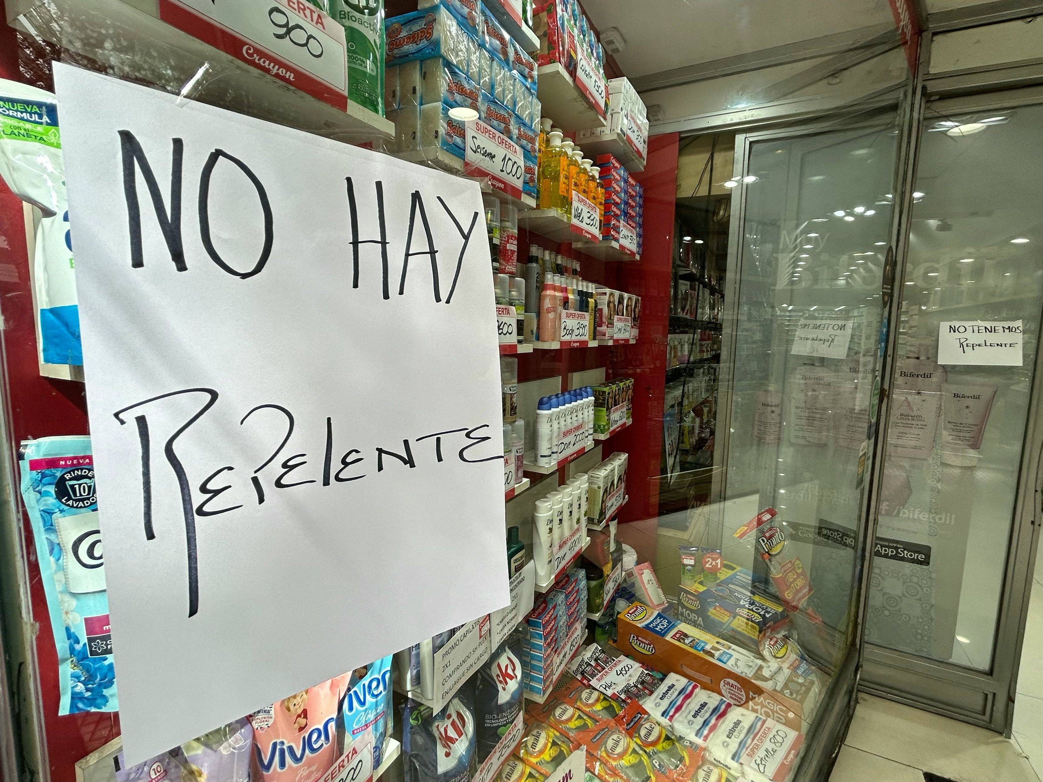 A sign reading “We Do Not Have Repellent” is displayed on the window of a store in Buenos Aires on Tuesday. Photo: AFP