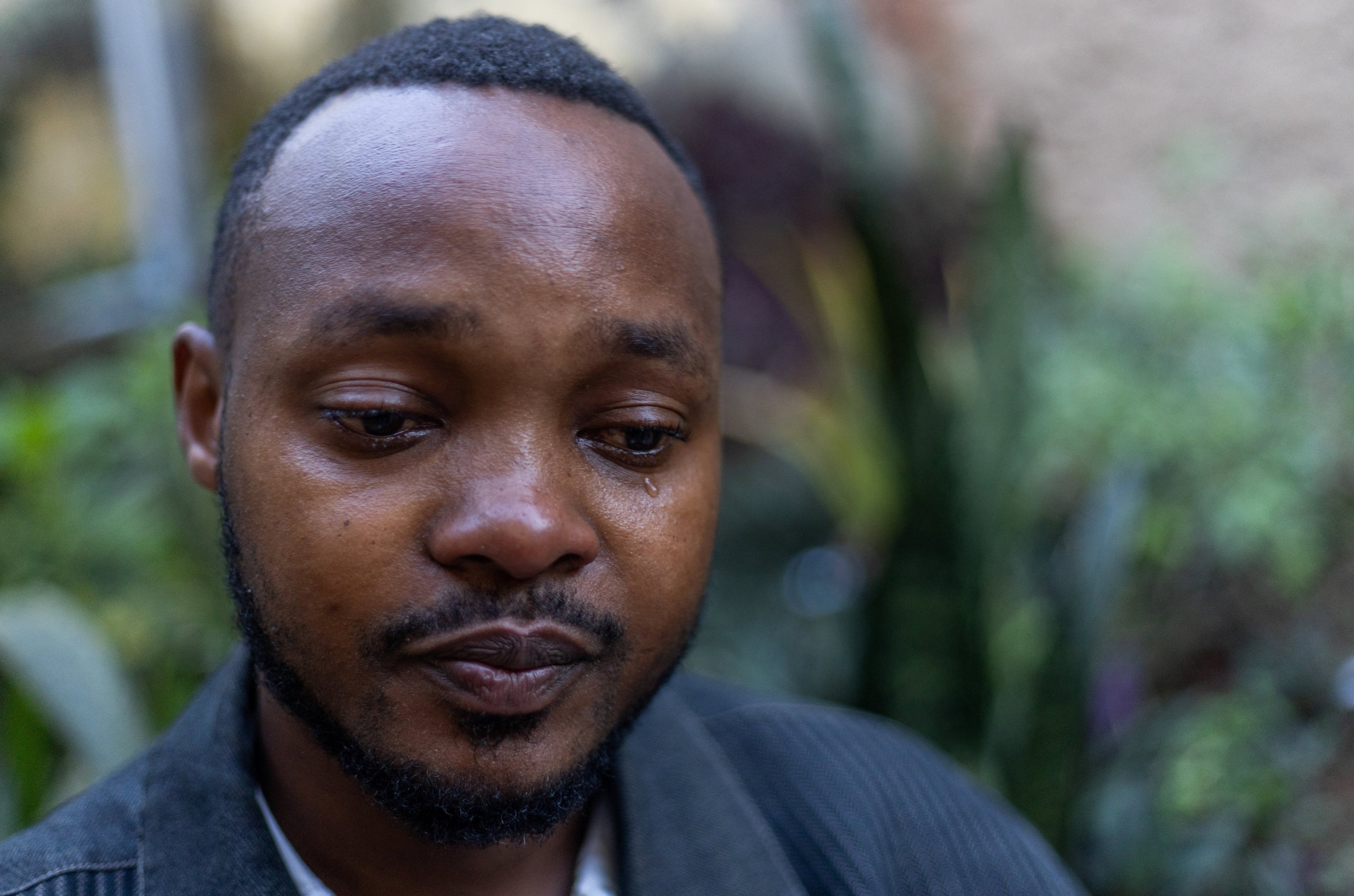 Eric Igiraneza reacts during an interview about his experiences of his mother rejecting him after he was born because she was raped during the Rwandan genocide in 1994. Photo: Reuters