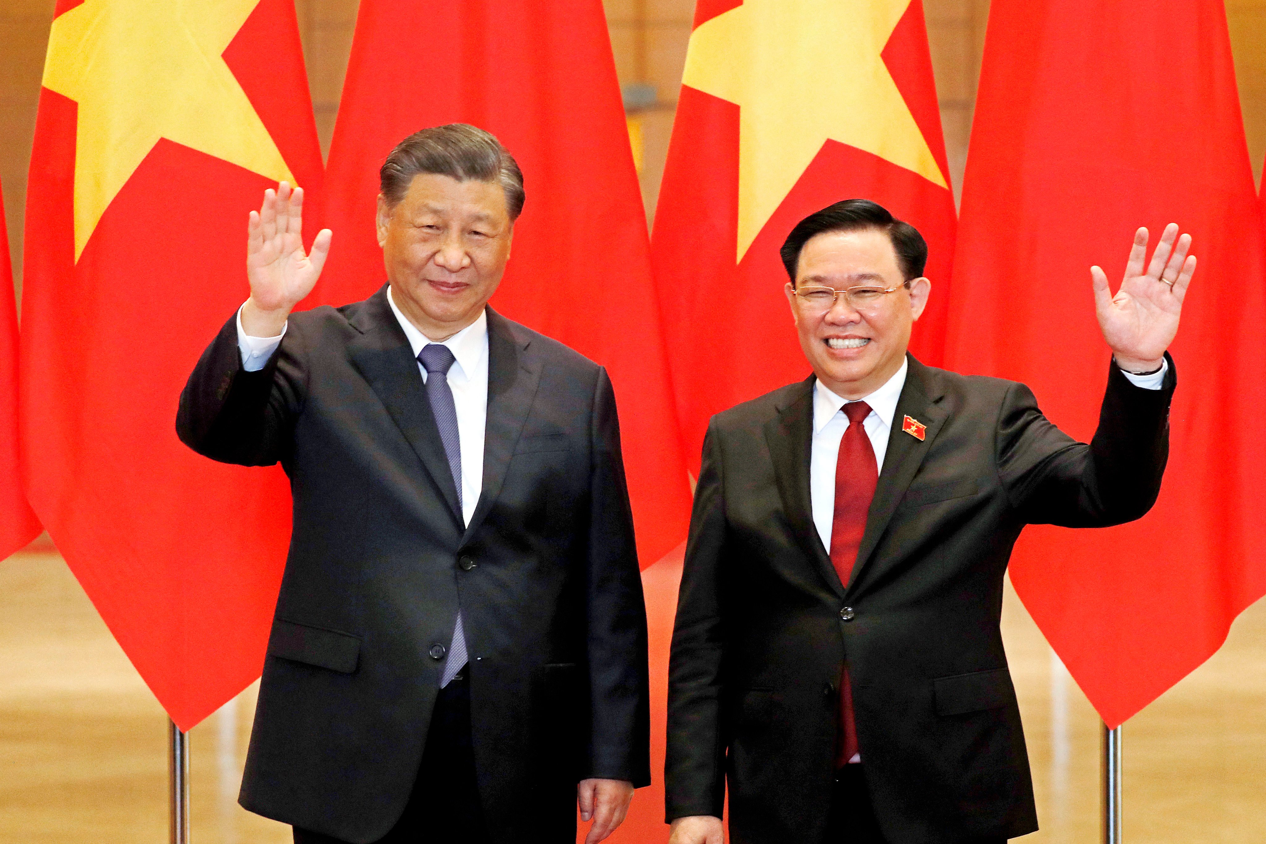 Chinese President Xi Jinping (left) and Vuong Dinh Hue, chairman of the National Assembly of Vietnam, in Hanoi in December, when the two countries agreed to build a “community with a shared future”. Photo: AFP