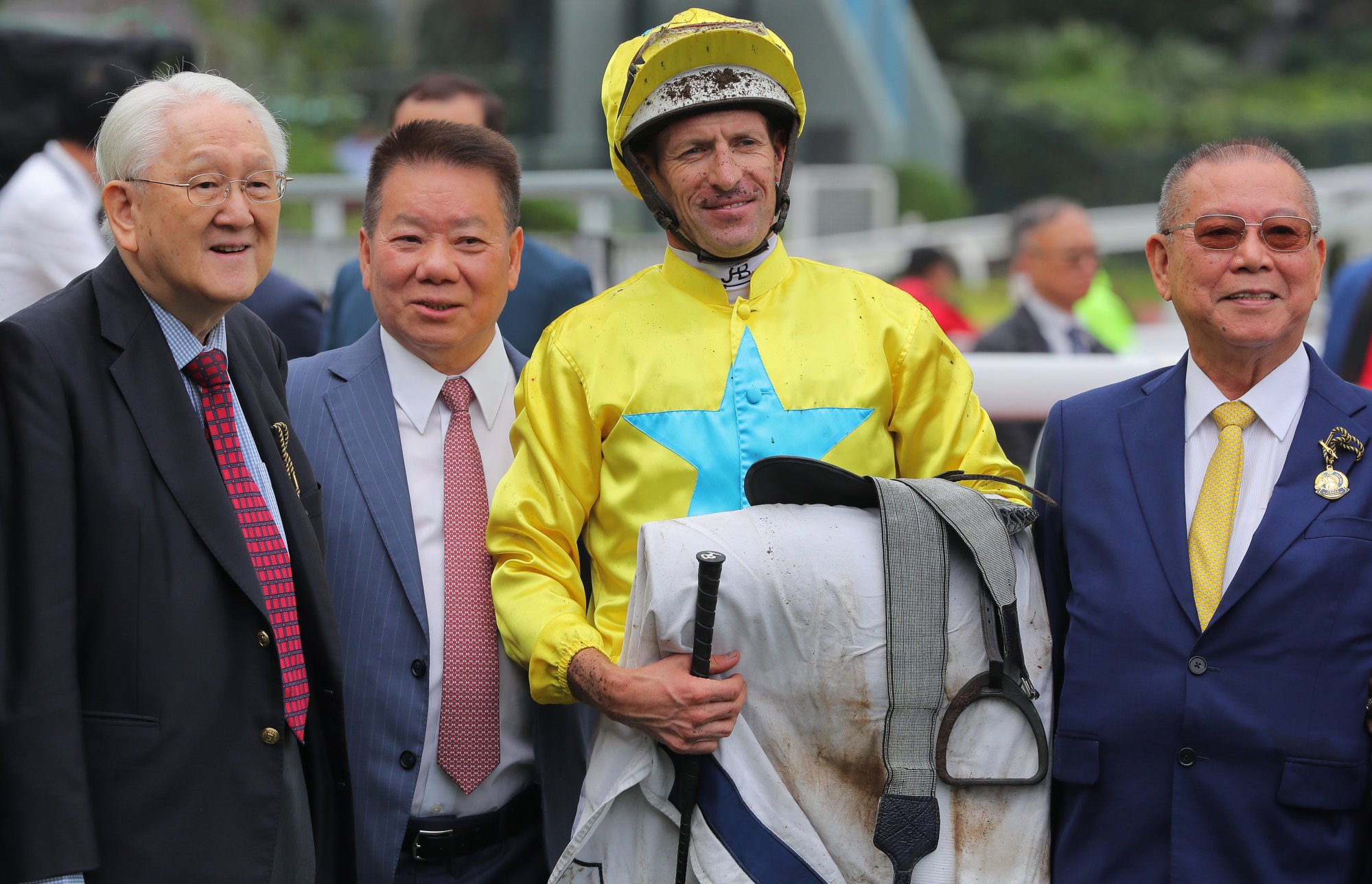 Jockey Hugh Bowman and trainer Manfred Man (second from left) celebrate Lucky Sweynesse’s Group Two Sprint Cup (1,200m) win with connections.