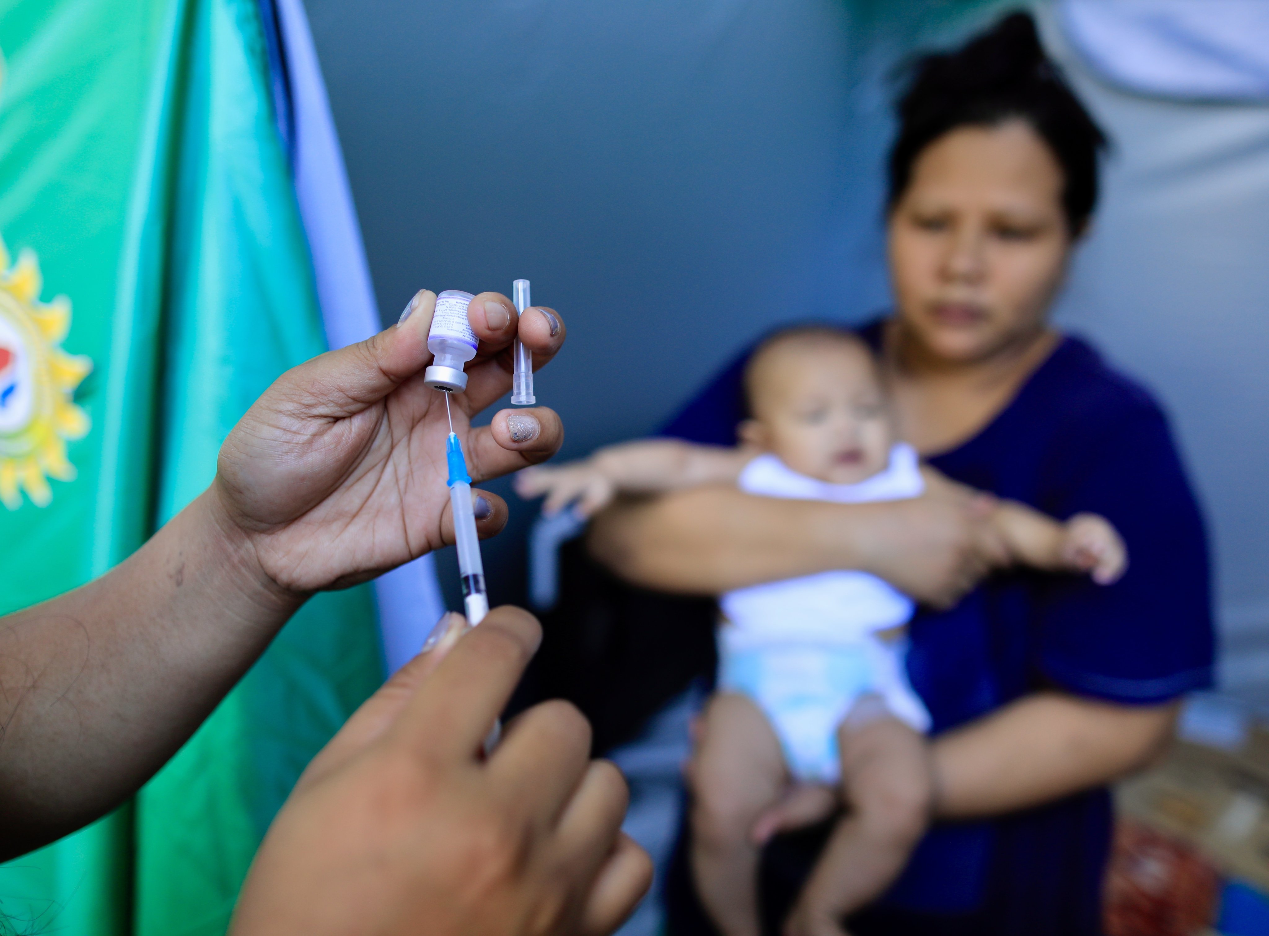 A Filipino health worker prepares a vaccine shot in Paranaque city, Metro Manila. The Philippines has some of the lowest child vaccination rates in the world, according to Unicef data. Photo: EPA-EFE